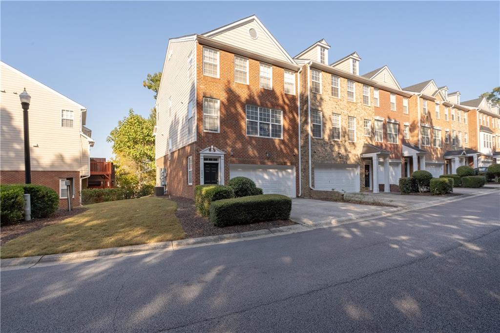 Welcome to this spacious, three-story end-unit townhome in the highly sought-after Creekside at Vinings community! The main level greets you with beautiful hardwood floors, a bright and welcoming living room complete with a cozy fireplace, and an open-concept kitchen ideal for entertaining. Step out to your private patio, perfectly suited for outdoor gatherings, and enjoy the convenience of a half bath on this level. Upstairs, the oversized primary suite awaits with elegant tray ceilings and a spa-like bathroom, offering a separate soaking tub, walk-in shower, and dual vanities. The top floor provides another generous bedroom with its own full bath, making it an ideal space for guests or a private retreat. On the lower level, you'll find a versatile and spacious TV/playroom, an additional bedroom and full bath, plus a covered patio. With its well-designed layout, modern amenities, and prime location, this home is a true must-see!
Brand New HVAC!