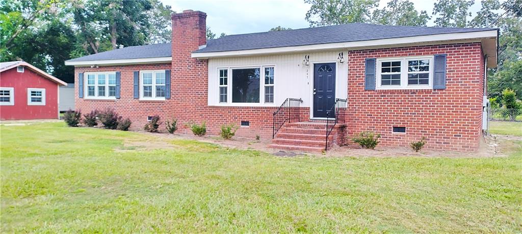 3BR/2BA Brick Ranch in the heart of Brooklet – 0.35 acres in a quiet neighborhood close to schools, dining, and shopping. Recent updates to this spacious home include a remodeled kitchen with Energy Star appliances, new Energy Star windows, fresh interior paint, new lighting and laminate flooring all under a roof less than 2 years old. The large rear deck is ready for relaxing or entertaining. Cozy wood-burning fireplace adds charm. The bonus room can be a perfect office, hobby/game room, or 4th bedroom. Vintage baths offer upgrade potential. Includes 16x24 powered outbuilding (as-is).