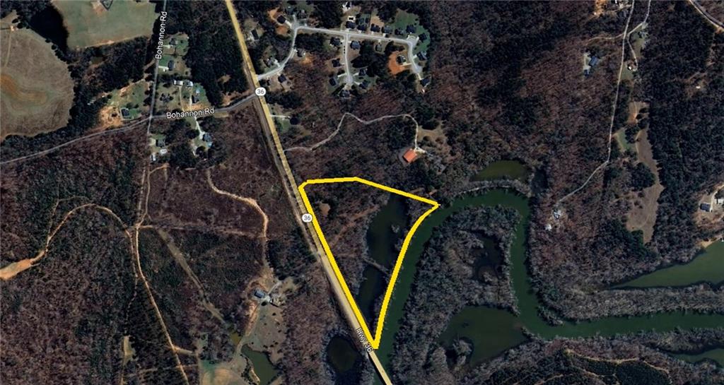 This beautiful property has everything you could need! One driveway leads to a space to dry dock a camper, two ponds great for fishing, and a concrete slip into the Yellow River. From the property you're only 300 yards from Jackson Lake! Yellow River allows motorized boats and is great for kayaking and canoeing. On the other end of the property sits a cleared homesite ready for your dream home. Perc test has been completed with multiple spots to place your septic tank. There's a path that can be cleared giving you a straight path to the river. These 19.47 acres have tons of white oak trees, and makes for a fantastic hunting spot.