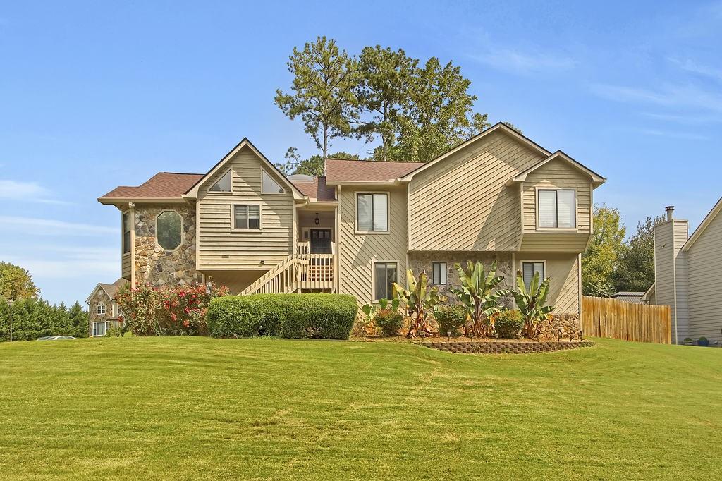 Come see this spacious home that sits on a corner lot. It's a 4-bedroom, 3-bath split-level residence in Suwanee's highly sought-after Richland Subdivision combines classic charm with extensive modern upgrades. With its versatile layout, impressive amenities, and prime location, this home is an ideal choice for families seeking comfort and community. Enjoy warm, inviting fireplace on chilly nights in the great room, owner's suite, and lower-level huge family room. The large 3 car garage offers ample space for vehicles, tools, and extra storage. The chef in your family will love the spacious kitchen, which features granite countertops, a newly installed dishwasher and refrigerator (2023), and a generous amount of stained cabinets for all your storage needs. This home offers peace of mind with a newer roof, windows, complete HVAC system, and a tankless infinity water heater. The exterior of the home was professionally painted in 2020, providing a fresh, well-maintained curb appeal The private backyard is perfect for entertaining, with a fire pit ideal for chilly and cozy days or nights. A 10x12 storage shed provides plenty of room for all your outdoor equipment. The HOA offers fantastic amenities, including two swimming pools, multiple tennis and pickleball courts, a clubhouse, a play area and a beautiful lake. Enjoy a strong sense of community with excellent neighbors and the convenience of walking to all the neighborhood amenities. Convenient to I-85, GA 316 and I-985. Close to schools, dining, shopping, arts and entertainment. Set up and appointment today just waiting for your personal touch!