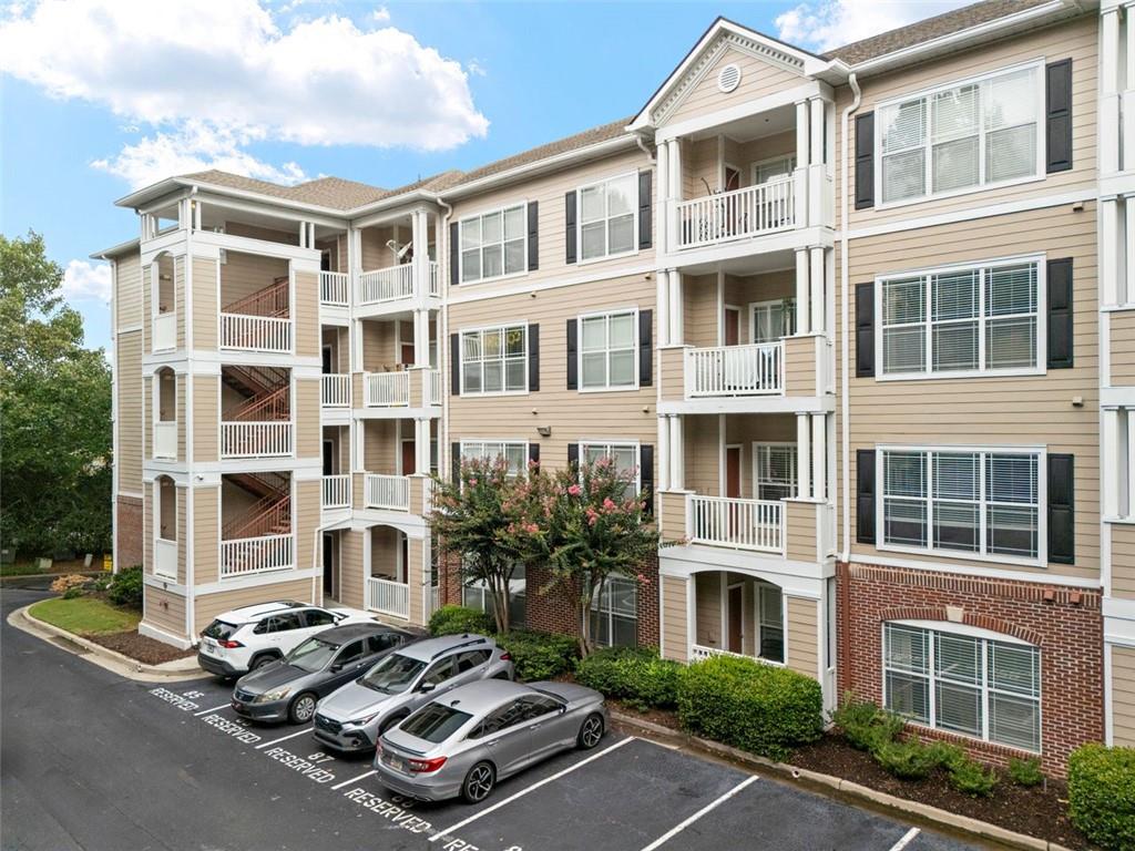 Don’t miss your chance to own this beautifully updated, move-in ready top-floor condo in the gated and meticulously maintained Terraces of Dunwoody community! This spacious, one-level end unit offers quiet serenity, a larger footprint and is perfectly positioned in a prime Dunwoody location just minutes from shopping, dining, and quick access to I-285 and GA-400.
Step inside to find freshly painted interiors that feel bright and welcoming. An elegant arched doorway leads from the foyer into a sunlit open-concept living and dining area, featuring a dramatic tray ceiling with crown molding and a wall of windows that flood the space with natural light. Step out onto your private covered balcony and take in peaceful, tree-lined views—your own serene retreat.
The full-featured kitchen opens to the main living space and boasts ample cabinet storage and counter space, a convenient breakfast bar, freshly painted cabinets, and newer stainless steel appliances, including an electric range and refrigerator. A newer dishwasher and built-in microwave add to the functionality.
The generously sized bedroom includes a walk-in closet with a built-in storage system and enjoys soft, natural daylight. The bathroom features a combination tub/shower, extended vanity, and an additional storage cabinet.
Additional perks include an assigned covered garage parking space close to the elevator and mailboxes. Water and valet trash service are included in the low HOA fee, and residents enjoy access to a sparkling pool, fitness center, clubhouse, outdoor grill area, and dog walking paths.
The Terraces of Dunwoody is FHA-approved and offers an unbeatable combination of location, value, and lifestyle. Come see why this condo is the perfect place to call home!