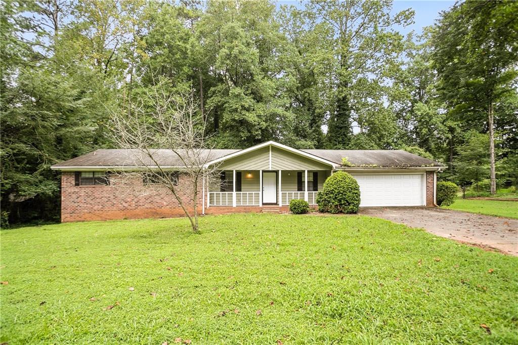 Nestled in the established and well-kept Concord Ridge neighborhood, this 4-bedroom, 3-bath ranch offers a great opportunity for those seeking value and potential. The main level features a vaulted family room with a cozy fireplace, a spacious kitchen with a breakfast area, and three bedrooms, including a master suite with its own bath. A separate dining room and welcoming front porch add to the charm. The finished basement includes an additional bedroom and full bath, perfect for guests, a home office, or extended living. The unfinished portion of the basement offers even more room to grow—ideal for storage, a media room, or future build-out. Set on a level, wooded lot, this home is perfect for buyers ready to bring their vision and make it their own. Conveniently located near shopping, public transportation, and major roads.