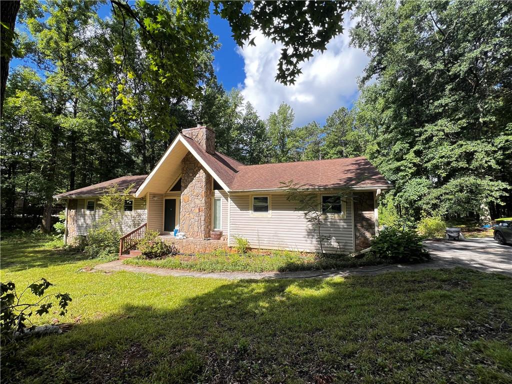 Welcome Home! Going through renovations!!! Ready in October!! This 3 bedroom 2 bathroom ranch home is set back on 2 acres. Walk inside to the floor to high ceiling flagstone wood burning fireplace. Continue into the large dining room area which leads into spacious kitchen featuring stone countertops, all brand new appliances, new cabinets w/ lots of storage & eat-in area. Spacious pantry. Large Master bedroom w/ closet & bathroom. Two additional bedrooms both with spacious closets. Deck w/ steps to very large open backyard! 2 car garage and a lot of space to park more cars or a boat on the driveway. Very private setting yet so convenient and close to town! Abundant parks and green spaces around, offering residents a lot of options for outdoor recreation. Close to restaurants, Costco, retail stores, gas stations. Home is available for rental in October.