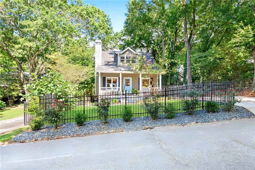 Discover This Stunning 3-Bedroom, 2-Bath Home in the Heart of Underwood Hills, Where Classic Charm Meets High-End Modern Updates. Built in 1998 and Completely Redesigned by a Well-Known Designer, It Is Filled With Natural Light, Abundant Windows, and Warm Character Throughout. The Main Level Features Two Bedrooms and a Full Bath, While the Spacious Owner’s Suite Occupies the Upper Level, Complete With a Luxurious Spa-Like Bathroom and a Dedicated Mini-Split System for Year-Round Comfort. Every Detail Has Been Carefully Considered—New Flooring Flows Throughout, Crown Molding Accents the Main Floor, the Entire Interior Has Been Freshly Painted, and High-End Blinds, Barn Door Leading to the Owner's Suite, New Led Lighting, and Upgraded Door Hardware Have Been Installed.
Upon Entering, You’re Welcomed by a Cozy Fireplace Beside the Dining Area, Leading Into a Show-Stopping Chef’s Kitchen Designed for Both Beauty and Functionality. It Boasts Extensive New Cabinetry for Abundant Storage, Sleek Quartz Countertops, a Large Center Island for Prep and Gathering, and Stainless-Steel Appliances. The Open Layout Flows Seamlessly Into the Spacious Family Room, Where Oversized Windows, All-New LED Lighting, and a Layout Designed for Both Relaxation and Entertaining Create a Perfect Gathering Space.
Step Outside to a True Entertainer’s Dream—A Brand-New, Oversized Deck That Easily Accommodates Both Dining and Lounge Areas, Perfect for Hosting Friends, Grilling Out, or Watching an Afternoon Football Game. From Here, You Can Enjoy Views of the Professionally Landscaped Front and Backyard, Complete With Fresh Sod, a New Drainage System, and a Powered Shed Ideal for a Workshop or Extra Storage. A Freshly Painted Front Porch With a Swing Welcomes Quiet Mornings, While New Fencing in Both the Front and Back Offers Privacy for Every Outdoor Moment. Long Driveway Can Easily Fit 4 cars.
The Location Is Unbeatable—Nestled in One of Atlanta’s Most Vibrant, Walkable Neighborhoods, Just Steps From Underwood Hills Park, Tennis Courts, and a Dog Park, and Minutes From The Works, Topgolf, Star Provisions, Howell’s, Felini’s, The Daily, and More. Warm, Welcoming, and Truly Move-In Ready, This Home Offers the Very Best of Westside Living.