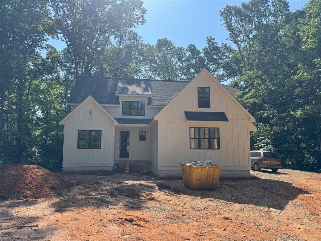 Stunning new construction in serene wooded Sherwood Forest neighborhood. Rare opportunity to have a new custom home on a .71 wooded lot just minutes from award winning Forsyth County Schools, the new Cumming City Center, easy access to GA 400. Active construction wear closed toed shoes. The site can also be muddy so be mindful of where you step.