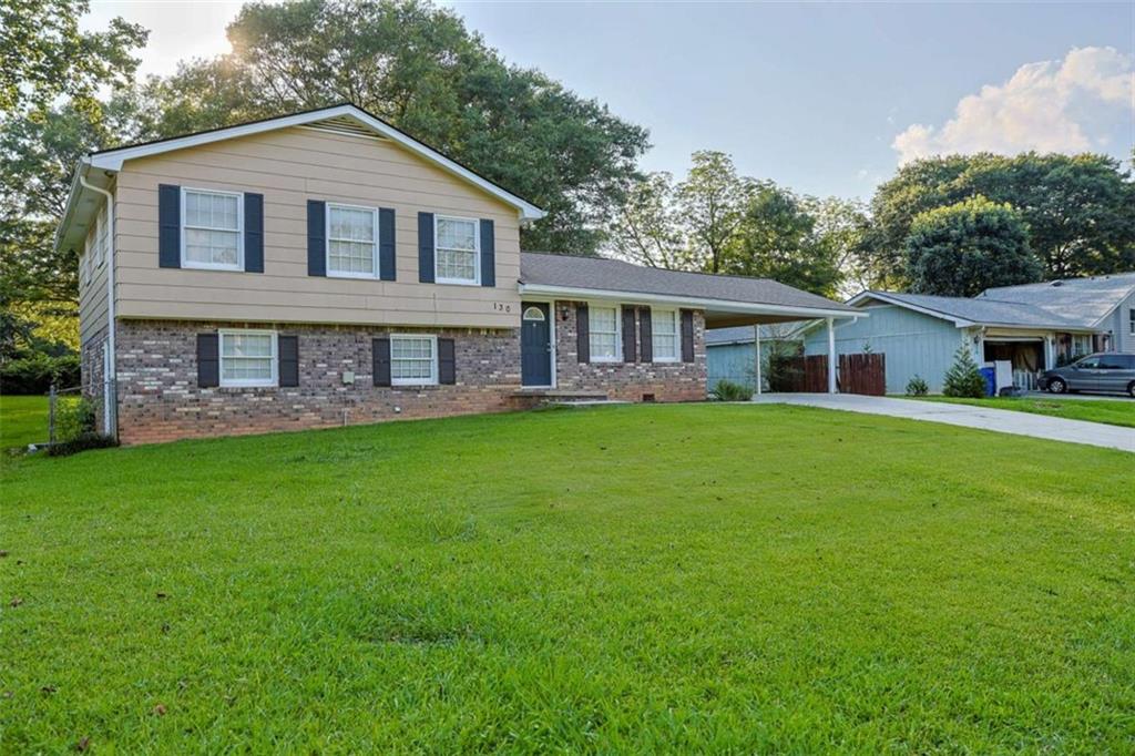 Discover the perfect blend of modern updates and timeless comfort in this beautifully refreshed 4BR 2.5BA finished basement home, quietly nestled just minutes from the heart of downtown Fayetteville with an unbeatable location! Home offers premium flooring throughout, including elegant ceramic tile on both the main and lower levels-combining sleek style with easy maintenance. The spacious kitchen is a true standout, featuring granite countertops, tile flooring, and abundant cabinet space. Each bathroom has been tastefully updated with ceramic tile, modern fixtures, and new toilets, while the primary bath includes a tiled shower and tub for a clean, spa-like experience. Downstairs, you'll find a bedroom and full bath, a kitchenette, and a versatile bonus room-perfect for a guest suite, office, playroom, or multi-generational living. Step outside into your large, private backyard-ideal for entertaining, weekend BBQs, or simply enjoying a quiet morning coffee under the Georgia sun. The 2-car carport adds practical convenience and extra storage for vehicles or gear. Location is key, and this home delivers. You're just minutes from Fayetteville's vibrant downtown scene, with quick access to top-rated restaurants, boutique shopping, Trillith Studios, and more. New Furnace, New Water Heater, New HVAC, Roof 3yrs old.