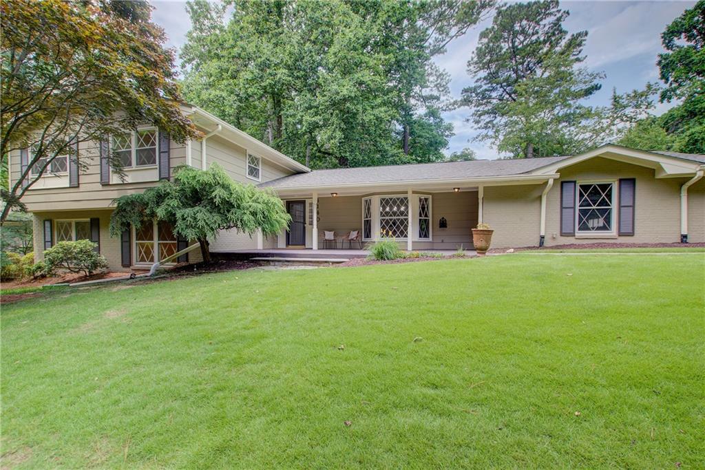 Homes like this don’t come available often! Nestled on a quiet cul-de-sac with unobstructed views into Murphy Candler Park, this beautifully maintained residence offers the perfect blend of charm, space, and modern convenience. Step inside to find freshly painted interiors and gleaming hardwood floors
throughout. The large dining room, complete with a cozy window seat, is ideal for gatherings. The spacious kitchen features abundant cabinet space, granite countertops, and stainless steel appliances. Start your mornings sunroom, the perfect spot for coffee and quiet moments. Upstairs, the primary suite includes an en-suite bathroom and walk-in closet. Three additional generously sized bedrooms and a full bathroom provide ample space for family and guests.
The lower level is designed for relaxation and entertaining, featuring a large family room with a fireplace and built-ins, a separate game or media room, an additional bedroom, and a full bathroom. You’ll also find a spacious laundry room—with its own convenient laundry chute! Enjoy the outdoors in the professionally landscaped front and backyard. The private deck is ideal for entertaining or simply unwinding. This home has been lovingly cared for with thoughtful updates including a newer roof and HVAC system (2024). Zoned for top-rated schools and just steps from walking trails, the Murphy Candler pool,
and ball fields—this home offers both comfort and community in one exceptional package. Don’t miss your chance to own this rare gem in Murphy Candler!