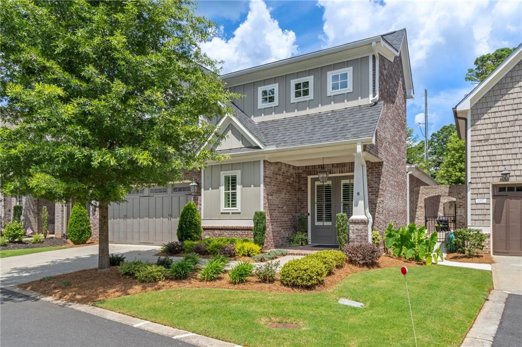 PRICED BELOW MARKET VALUE!! Stunning Craftsman-Style Home Built in 2021 – Primary Suite on Main & Low-Maintenance Living!Welcome to this meticulously maintained, move-in-ready Craftsman-style home offering the perfect blend of elegance, functionality, and convenience. Built in 2021 with durable cement siding and brick, this home combines timeless beauty with lasting quality Step inside to discover an open, light-filled floor plan highlighted by gleaming hardwood floors and elegant plantation shutters throughout the main level. The spacious living area flows seamlessly into a gourmet kitchen that’s a chef’s dream—featuring quartz countertops, top-of-the-line stainless steel appliances, a gas cooktop with designer hood, an oversized island with upgraded fixtures, and abundant prep and storage space. The luxurious main-level primary suite provides a peaceful retreat, complete with a HUGE walk-in closet and a spa-inspired bath boasting dual vanities and a beautifully tiled designer shower. With three full bathrooms and one half bath, this home is designed for ultimate comfort and convenience. A thoughtfully finished, climate-controlled storage room adds exceptional versatility and additional functionality. Extend your living space outdoors with the private screened-in porch—perfect for year-round relaxation. Designed for a lock-and-go lifestyle, the HOA handles all landscaping, making this an ideal choice for travelers or anyone seeking low-maintenance living. Perfectly located off Hwy 92, enjoy easy access to Roswell, Woodstock, and East Cobb, with top-rated schools, dining, shopping, and lifestyle amenities just minutes away. Don’t miss the opportunity to make this beautiful home yours!