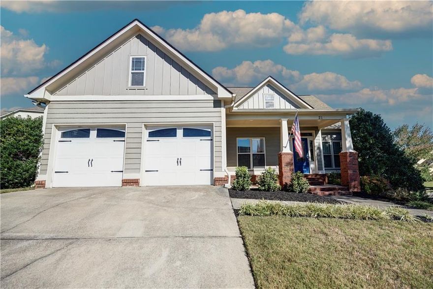 CHARMING CRAFTSMAN WITH IN-LAW SUITE AND FULL-SERVICE SALON SETUP IN POOLSIDE NEIGHBORHOOD! Situated on a LUSHLY LANDSCAPED CORNER LOT, this meticulously designed residence offers the perfect blend of timeless architecture and modern comfort. As you approach, you will be mesmerized by the quintessential Craftsman curb appeal of the facade, with handsome CEMENT SIDING and classic BRICK accents. Guests arrive at the front entry to be greeted into the warm and welcoming atmosphere of the main level footprint. The living room boasts SOARING CEILINGS and a romantic, GAS LOG FIREPLACE, providing a cozy ambiance to snuggle in on those chilly winter eves. EAT-IN KITCHEN features CERAMIC TILE FLOORING, STAINLESS APPLIANCES (including REFRIGERATOR), and handy PANTRY, and opens to a partially-covered PORCH, overlooking the FENCED BACKYARD - a laid-back setting to sip morning brew or host Fall gatherings! A spacious DINING AREA is also in place for more formal meals, and is open to the living room in a flawless flow. The generous OWNERS SUITE provides a peaceful escape, and is equipped with TRAY CEILINGS and WALK-IN CLOSET, as well as a spa-like ensuite with DUAL VANITY, JETTED TUB, and SEPARATE SHOWER. The secondary bedrooms on the main level are also generously-sized, and share a hall bath with tub/shower combo. The LOWER LEVEL could be utilized as a future IN-LAW SUITE. Currently in place is a 2ND LIVING ROOM with built-ins; FULL-SERVICE SALON AREA; BEDROOM; FULL BATH with stall shower; LARGE GAME ROOM; and STORAGE ROOM. (The lower level is not serviced by HVAC at the present time.) Located in a PICTURESQUE NEIGHBORHOOD with COMMUNITY POOL and PLAYGROUND in ADAIRSVILLE SCHOOL DISTRICT, convenient to I-75, schools, shopping, dining, and more! Welcome Home to 21 Barnsley Forest.