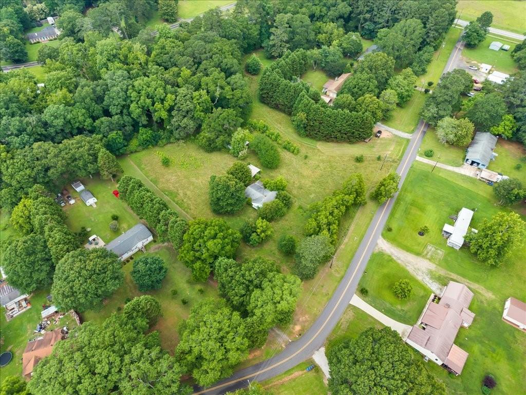 Don’t miss this incredible opportunity in the growing city of Bogart! This 4.37-acre property offers multiple possibilities — perfect for investors looking to build new construction or renovate the existing home on site. It’s also an excellent choice for someone who wants to enjoy a spacious piece of land with privacy, while still being close to all the conveniences of town. Located just minutes from Athens, Hwy 78, and shopping, this property combines potential and location in one great package.
