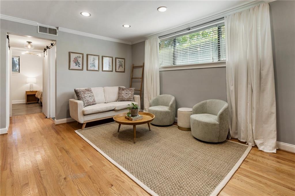 Just one block from Piedmont Park, Glendale Heights offers a peaceful community in the Garden District, surrounded by lush landscaping. This updated one-bedroom condo features a modern kitchen and bath, ample storage, and space for an at-home office. Living on the terrace level provides easy parking access and quick proximity to Midtown's vibrant amenities. Enjoy plenty of natural light and privacy, with the unit perched above street level to shield you from noise. The community also offers a refreshing pool and low monthly HOA fees for added convenience, a rare find in the area! Complete with one off-street parking space, new light fixtures, solid wood sliding doors, and fresh paint—this home is ready to welcome you! Building pet policy: no dogs larger than 20lbs, limit of 2 dogs or cats per unit, cannot exceed 20lbs combined. Not pit bulls or aggressive dogs.