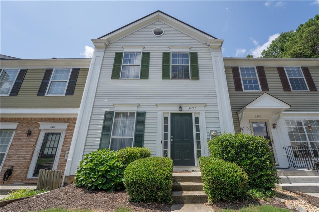 Welcome to 3497 Mount Vernon Cir, Atlanta, GA 30340 — a beautifully updated 3-bedroom, 3.5-bath townhome in a gated community offering over 1,460 sq ft of stylish living space with a finished basement. This move-in ready home features a spacious living area, updated kitchen with granite counters and stainless steel appliances, vaulted ceilings upstairs, and a finished terrace level with a cozy fireplace and additional half bath—perfect for a home office, bonus room, or guest suite. Enjoy outdoor living with a private deck and fenced patio, plus community amenities including a pool and assigned parking. Conveniently located near I-85, I-285, and MARTA, this home blends comfort, style, and location perfectly.