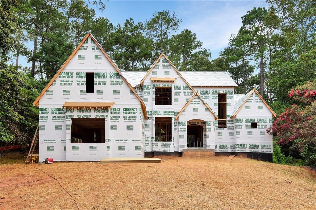 Located in the highly sought-after Heards Ferry school district, this stunning 6-bedroom, 5.5-bathroom home features a desirable owner’s suite on the main level, a three-car garage, an UNFINISHED basement, and room for a pool—offering spacious, functional living in the heart of Sandy Springs. Step through the arched front porch into a soaring two-story foyer. The main level includes a den, a guest suite with a private bath, and an open-concept kitchen with a vaulted ceiling, island, double oven, range, and walk-in pantry. The kitchen overlooks the family room with a fireplace and sliding doors that open to a covered rear porch with a second fireplace—perfect for year-round entertaining. The owner’s suite on the main level boasts separate his and hers walk-in closets and a luxurious bath with double vanities, a soaking tub, and a separate shower. A laundry room is also conveniently located on the main floor. Upstairs, you’ll find four generously sized bedrooms—each with walk-in closets—three bathrooms, and a finished storage area. Enjoy optional swim and tennis amenities with membership at the nearby Riverside Club. This prime location offers easy access to top-rated public and private schools, Sandy Springs City Walk, and a variety of restaurants, boutiques, and entertainment.