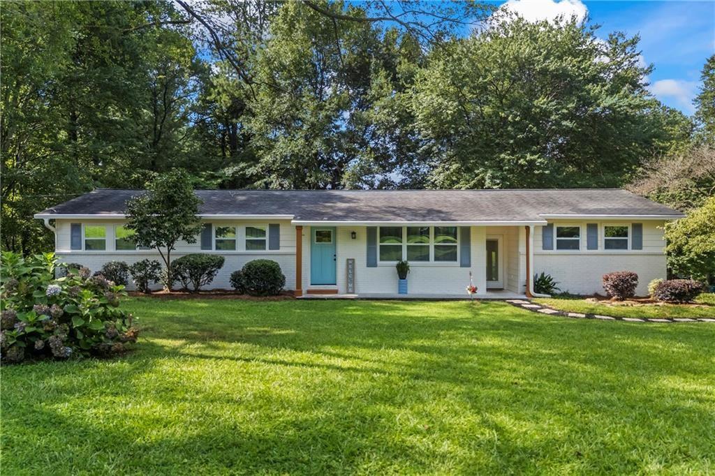 Welcome to this beautifully remodeled home nestled in a highly desirable Smyrna neighborhood. Situated on a premium corner lot, this property has been transformed into a true dream home with no detail overlooked. As you step inside, you’re welcomed by brand new floors, modern accent walls, and a seamless open-concept layout that flows effortlessly from the spacious family room into the stunning kitchen. Designed with both style and function in mind, the kitchen features floor-to-ceiling tile backsplash, sleek white soft-close cabinets, abundant granite countertops, and a custom island with butcher block ends—perfect for all your cooking and entertaining needs. Just off the kitchen, a large bedroom with a walk-in closet offers incredible versatility, whether as an in-law suite, guest room, office, or playroom. The home features two front entrances and ample storage throughout. With three spacious bedrooms and two fully updated bathrooms, every inch of this home has been thoughtfully designed. The expansive master suite combines two former rooms to create a luxurious retreat, complete with a private back door that leads to a porch with a built-in Jacuzzi—your own personal oasis. Recent upgrades include brand new HVAC and ductwork, new plumbing and electrical, new energy-efficient windows, fresh paint inside and out, and recessed dimmable lighting with a retractable fan. A custom media nook keeps wires hidden for a sleek, polished look, and the newly built laundry room adds even more functionality. Located near major highways, top-rated schools, and popular shopping and dining, this home offers the feel of new construction without the high price tag. Don’t miss your chance to own this exceptional property—schedule your private showing today!