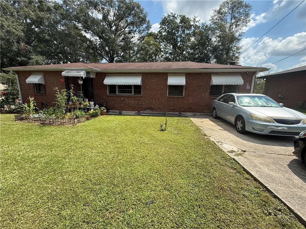 Investor’s Dream in Covington! This 3-bedroom, 1-bathroom brick ranch offers 1,306 sq ft of solid potential on a spacious lot. Built in 1954, this full-brick home provides timeless durability and a classic layout ready for your updates. Conveniently located near Covington’s growing community and amenities, this property presents a rare opportunity to add instant value with minimal effort. Don’t miss your chance to own a highly desirable brick property in a fast-moving market!