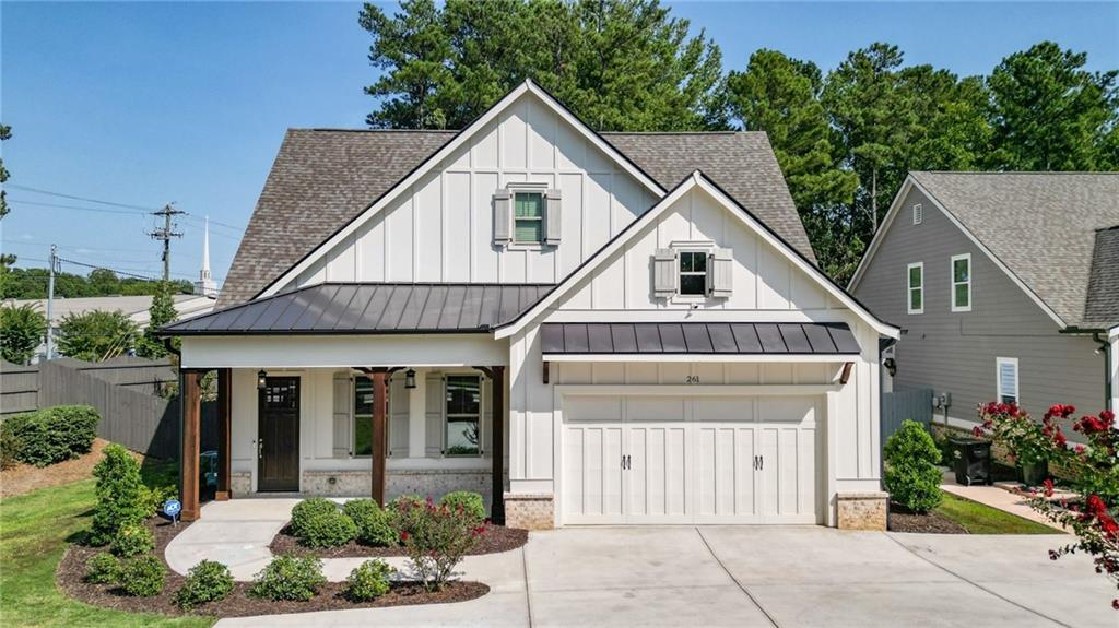 Welcome to this stunning modern farmhouse located in the highly desirable Harrison High School district of Powder Springs, GA. This home exudes charm and elegance with its inviting entrance foyer, leading to a spacious and separate dining room perfect for family gatherings. The heart of the home is the chef’s kitchen, complete with a massive island, walk-in pantry, and open-concept living space that seamlessly flows into the great room.  Enjoy the convenience of having the owner's suite on the main level, offering a private retreat with an en-suite bathroom and walk-in closet. Upstairs, you’ll find a versatile loft/bonus room ideal for a home office, playroom, or extra living space.  Relax in the screened-in porch, overlooking the beautifully landscaped, private, fenced-in backyard — perfect for outdoor entertaining or quiet relaxation.  This home combines modern amenities with farmhouse charm, all within a prime location near top-rated schools, shopping, and dining. Don't miss the opportunity to make this dream home yours!