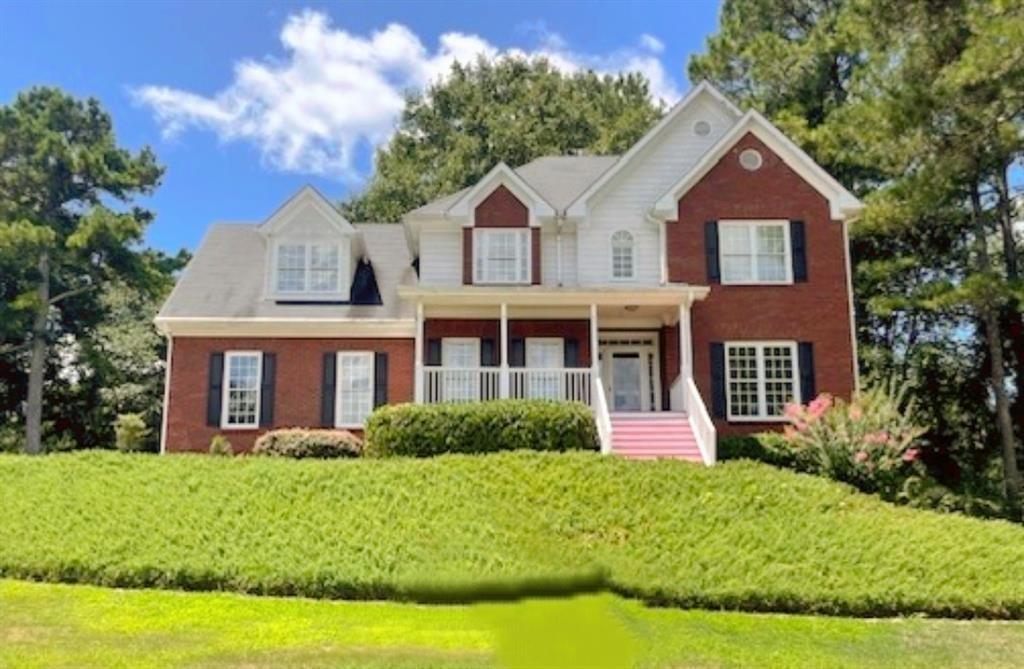 For Lease or Lease-purchase Spacious 7-Bedroom home with In-Law Suite. Welcome to 8100 Greens Mill Way – a beautifully maintained 7-bedroom, 3.5-bath home on a serene, very private, elevated 0.6-acre lot in one of Loganville’s most sought-after neighborhoods. Step inside to a grand two-story foyer and gleaming hardwood floors throughout the main level. The home’s expansive layout offers a formal dining room, cozy living room, and a sun-drenched family room with a charming fireplace. The heart of the home is the stunning kitchen, featuring brand-new granite countertops, ample cabinetry, a cheerful breakfast nook, and open views of the backyard oasis. Upstairs, the oversized owner’s suite boasts tray ceilings, a spa-style bath with jetted tub, dual vanities, and a generous walk-in closet. Three additional bedrooms and a convenient laundry room complete the second level. The fully renovated third-floor in-law suite is a standout bonus. It offers three bedrooms, a full bath, laundry, a kitchenette, and its own private entrance—ideal for multigenerational living or rental income. Recent upgrades include new ceiling fans, water-saving toilets, fresh interior paint, a new AC unit, and more. Enjoy peaceful mornings in your backyard oasis with scenic views, or host unforgettable gatherings with plenty of entertainment space.
Don't miss this rare opportunity—schedule your private tour today before it's gone!