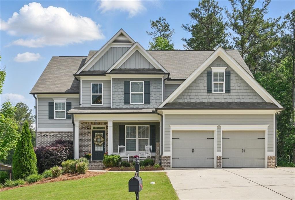 For all intents and purposes, welcome home!! This North Paulding County traditional style home is in search of its next homeowner. Boasting 5 bedrooms, 4 full baths, and sitting on an unfinished, oversized, daylight basement, this home offers room for growth. Enter into the open concept living area
overflowing with natural light and neutral tones throughout. Enjoy hosting guests in front of the stone fireplace beneath a coffered ceiling
while you prep meals in your kitchen. Have charcuterie trays set up on the oversized island while you chill a bottle of chardonnay in the
wine cooler. This kitchen comes complete with a full sized pantry, granite countertops, shaker cabinets, stainless steel appliances, and a
separate counter space perfect for a coffee making station or a place to display your favorite bottle of Bourbon. One full bedroom and
bathroom are on the main floor, perfect for a home office, playroom, or separate guestroom. Head up the turn style stairs to find a loft
space and 4 full bedrooms. A jack and jill bathroom joins 2 of the bedrooms while the final secondary bedroom has its own private
bathroom. The primary bedroom offers a tray ceiling, a walk in closet, and an oversized bathroom with dual vanity, a soaking tub, and a
standalone shower with dark tiles and a bench. The unfinished basement offers endless possibilities to be finished off or left as-is to build
out a home gym, game space, or even just ample storage. Enjoy the sunset on the covered back deck while you enjoy the feel of a cross
breeze. Seven Hills subdivision offers resort style amenities like pickleball, tennis, volleyball, and basketball courts, a splash pad, Junior
Olympic sized swimming pool, a dog park, clubhouse, playground, a picnic pavilion, and hiking and biking trails throughout the community.
Book your tour today!