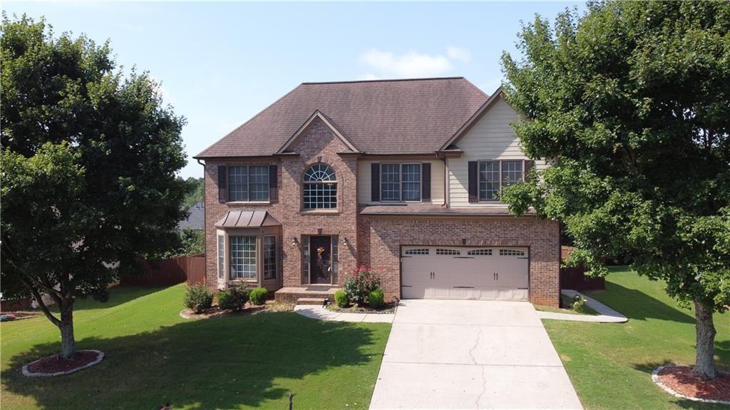 Beautiful 2-story traditional in Buford !!!! 5 bedrooms and 3 1/2 bath on full finished basement. Recent interior and exterior paint. New carpet. Kitchen features granite countertops, island, stained cabinets, and SS appliances. Newer flooring throughout house. Basement offers bedroom, full bath, and living area. Huge deck. Level fenced backyard. Community amenities include swim and tennis.
