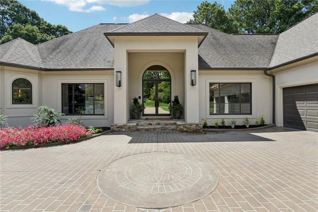 An Exceptional Renovated Estate on the 6th Hole of Polo Golf & Country Club. Discover the pinnacle of refined living at 6905 Polo Drive, a fully renovated ranch with a finished terrace level and 3-car garage, perfectly situated on the prestigious 6th fairway. Every element of this home has been thoughtfully redesigned with exquisite detail and sophistication. A dramatic new front entry framed by striking windows sets the tone for the elegant interiors beyond. Inside, enjoy an open, light-filled design with custom cabinetry throughout, designer lighting, and all-new flooring. The chef’s kitchen is a true showpiece, featuring a completely new layout, custom cabinetry, and professional Thermador and Wolf appliances. The primary suite boasts a luxurious spa-inspired bath and custom closet, while each ensuite bathroom has been fully reimagined with designer tile and finishes. Modern upgrades include a whole-house audio system, motorized shades, updated electrical wiring, designer lighting, and fresh paint inside and out. The home features two laundry rooms, one on each floor. The outdoor living spaces rival the interiors: a spacious veranda with a louvered pergola, outdoor kitchen, and fireplace lounge with motorized screens—all overlooking the lush golf course. A private putting green, fully renovated landscaping, and upgraded irrigation complete this unparalleled retreat. This is more than a home; it’s a statement of elegance, craftsmanship, and lifestyle. Ideally located near top-rated schools, fine dining, and premier shopping, this home offers elegance, convenience, and an unmatched lifestyle. Experience the finest in Polo living—schedule your private tour of this exceptional home today.