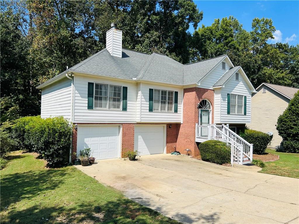 Welcome to 284 Legend Creek Lane in Douglasville, located in sought-after Paulding County! This spacious and well-maintained home offers over 2,300 sq ft of living space on a beautiful 1.38-acre property, giving you ample room for all your outside plans and activities! Inside, the home features 4 bedrooms and 3 full bathrooms, including a downstairs suite with a bonus room, bedroom, and full bath-ideal for guests. The primary suite is a true highlight with a walk-in shower, double sinks, and a whirlpool tub for spa-like comfort. The home also includes a formal dining room and a cozy fireplace. The kitchen is designed to impress, boasting granite countertops, ample custom cabinets, a built-in window seat, and above grade stainless steel appliances, including a 36-inch, six-burner gas oven and a Sub-Zero refrigerator-perfect for cooking and entertaining. Step outside to the deck overlooking your private backyard, providing the perfect setting for relaxing evenings or gatherings with friends and family. This property combines comfort, convenience, and scenic beauty-making it an exceptional place to call home.
