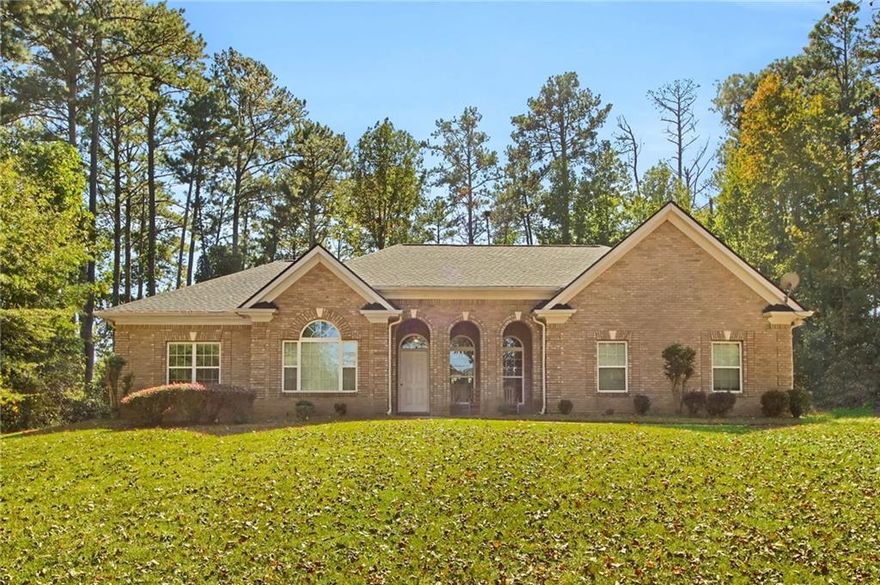 Welcome to this spacious ranch-style, four-sides brick home on a 1.1-acre lot in the rapidly growing Conyers area. Set back with a large backyard bordered by private woods, this property offers both privacy and convenience, just minutes from Route 138.

Inside, the single-level floor plan features 3 bedrooms, 2.5 bathrooms, and a versatile office/den. The vaulted ceilings and open layout create an airy feel, while the screened-in patio provides a perfect space to relax and enjoy the serene views. The secondary bedrooms share a Jack-and-Jill bathroom with dual vanities, while the primary suite features new carpet and plenty of natural light.

The eat-in kitchen is designed for both function and style, offering double convection ovens, granite countertops, and stainless steel appliances, all overlooking the backyard.

Additional highlights include new roof (June 2025), new water heater (Sep 2025), sprinkler system, central vacuum system, shed with power, leaf guard system with lifetime warranty, and timeless four-sided brick construction. This property is being sold as-is.