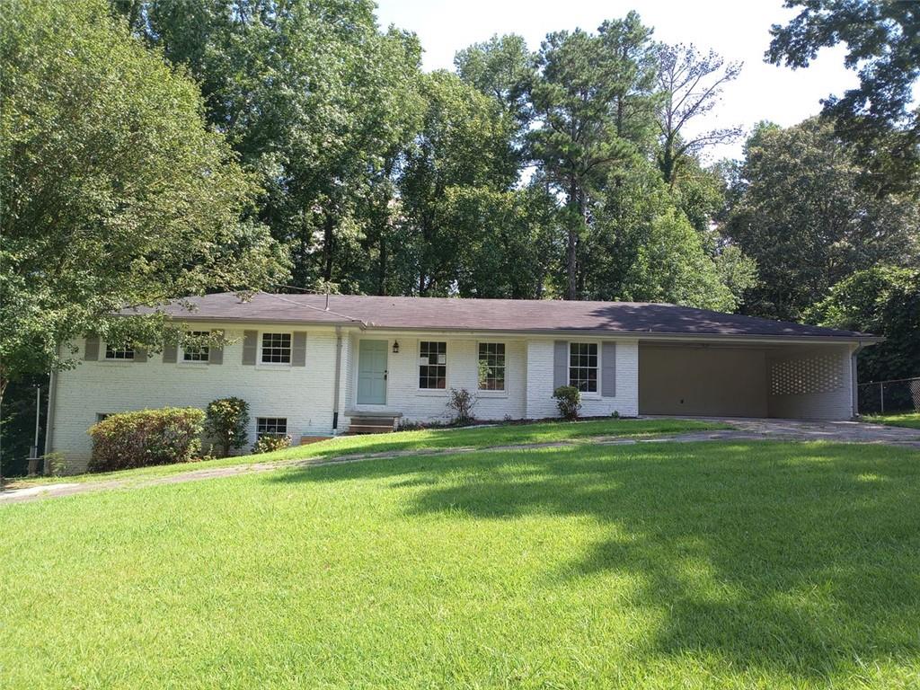 Updated brick ranch located in Shallowford Heights. Features include, Bright and open floor plan with great room and dining room, 3 bedrooms and 2 full baths on the main level plus a full finsihed lower level with a brick fireplace and 3rd full bath. Luxury Vinyl Plank flooring throughout, updated lighting and plumbing fixtures, granite countertops in the kitchen and bathrooms, stainless-steel appliances. Bright and open floor plan, Great curb appeal with a circle driveway, large front and back yard. So much house for the price. Do not miss this one!