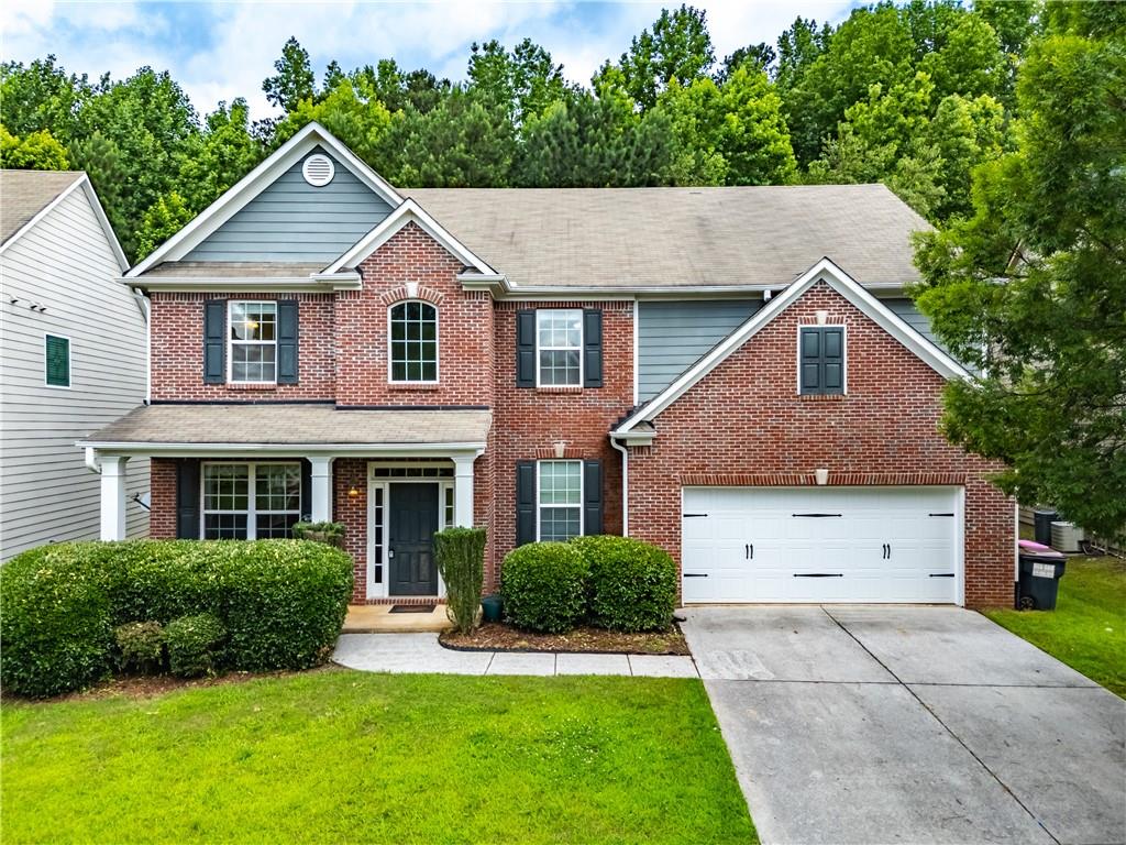 Welcome to the stunning home in the impressive Hamptons subdivision. Perfectly situated in the highly sought-after Seckinger High School district! This spacious 4-bedroom, 3.5 bath home is nestled within the vibrant community featuring a pool, tennis courts and playground. Step inside to find gorgeous hardwood floors flowing throughout the main level, creating an immediate sense of warmth and inviting atmosphere. The open-concept kitchen features a view into the inviting family room, complete with a cozy fireplace and custom built-in bookshelves, perfect for relaxing and gatherings. A separated, dedicated formal dining room features a large window for natural light, ample space for a substantial table and sideboard, and reminded finishes designed for gracious hosting. Upstairs, the oversized loft offers endless possibilities - a children's playroom, media/game room, home office, or quiet retreat. The oversized master suite impresses with tray ceilings. The spa-inspired bath features dual vanities, a soaking tub and a walk-in shower. Three additional well-sized bedrooms and two full baths provide comfortable accommodations for family or guests. Step outside from the kitchen to the private & fenced backyard oasis, complete with an expanded patio – ideal for outdoor dining, entertaining, or simply enjoying the serene setting. Conveniently located near I-85 and (10) minutes to the Mall of Georgia for fine shopping and dining. Walking distance to Kroger and restaurants. Enjoy the private oasis near all of the excitement Buford/Hamilton Mill has to offer!