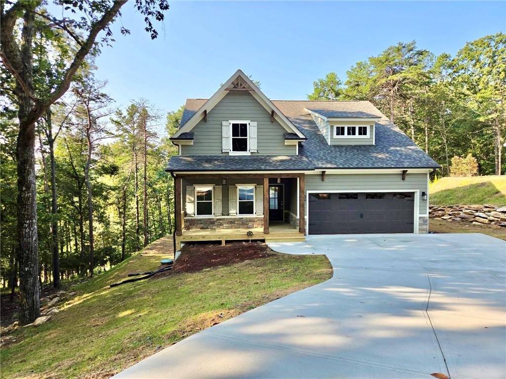 Look No Further! Move In Ready! Private Covered Front Porch Welcomes You into this Spacious Open 2 Bedroom 2 Bath on Main w/additional 2 Bed and 1 Bath on upper level, Gourmet Kitchen w/Open Concept Dining, Private Oversized Master w/Spacious Walk-In Closet, Double Vanity, Covered Front Porch and Expansive Rear Covered Deck.
