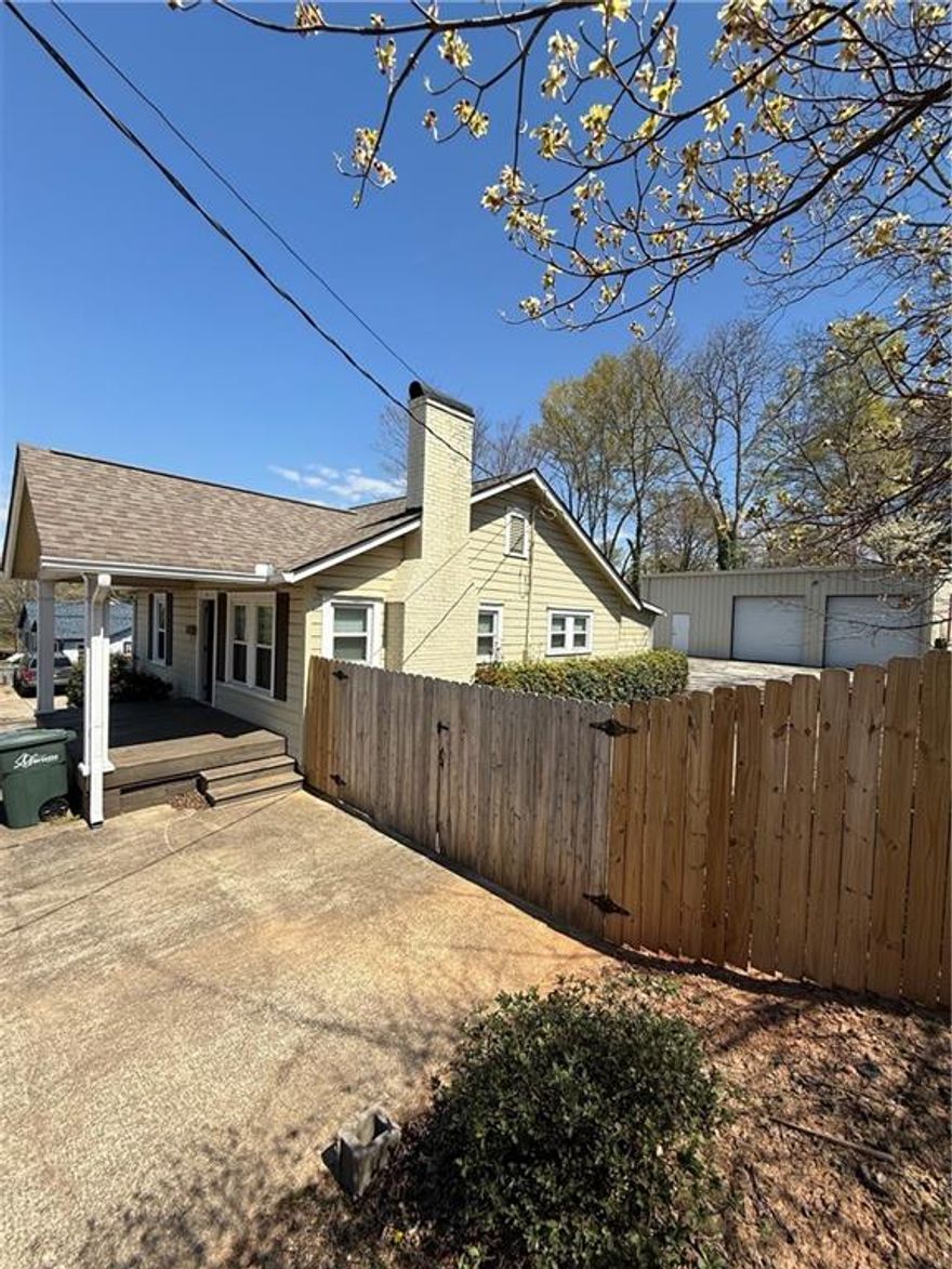 Renovated property has 2 building on one lot. Front building used as a professional office. Free standing industrial warehouse in the back at 1,300 sq ft & 15' ceiling height. Fenced and gated. Parking lot for multiple vehicles.