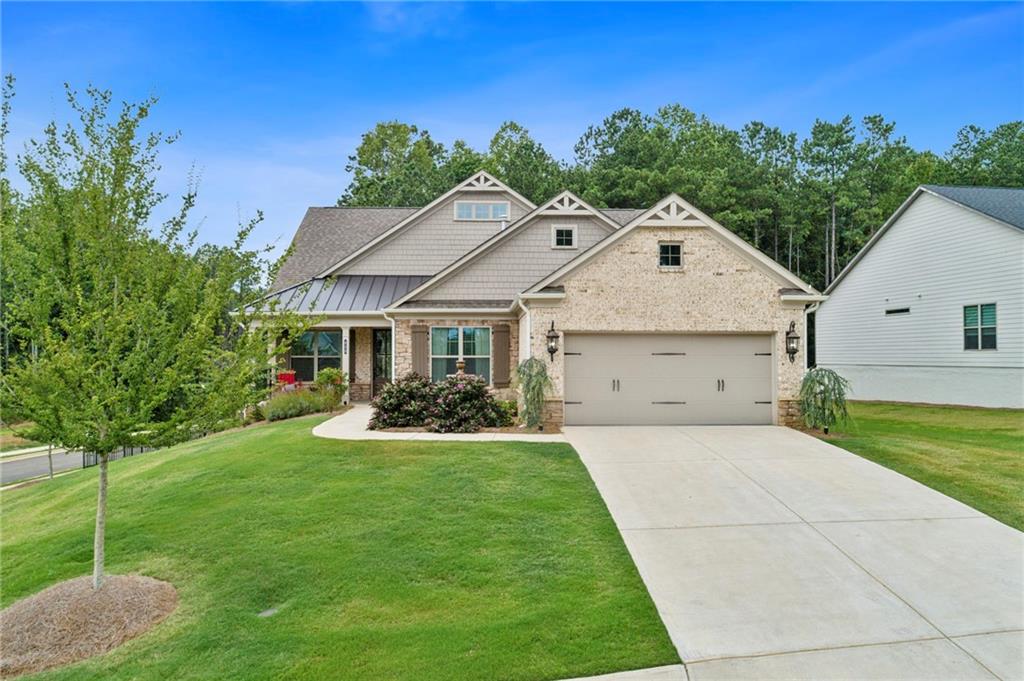 Explore a unique opportunity in the world of new construction! Situated within the prestigious Soleil Belmont Park community in Canton, this residence is conveniently located just minutes from the delightful Downtown Canton and a short drive to Atlanta. Enjoy the benefits of a brand-new home, equipped with numerous high-end features already included. Welcome to this exceptional 55+ premier community developed by Patrick Malloy. This remarkable premium lot, no longer available within Soleil, offers a fenced area suitable for a potential pool, coupled with a finished basement. This exquisite, better-than-new home provides resort-style amenities within a premier gated active adult community, ready for immediate occupancy.
With nearly $200,000 in upgrades and finishes, this stunning single-level home with a fully finished basement boasts a spacious, fenced backyard, perfect for your furry friends—all at a competitive price. The interior showcases a beautiful design, featuring hardwood flooring throughout, an expanded owner's suite, designer touches, upgraded bathrooms, and elegant lighting. Bathed in natural light, the home features an ideal open-concept living layout, complemented by exceptional outdoor living spaces.
Meticulously designed, this residence includes all the sought-after features you would choose if building from scratch, eliminating the wait. The open floor plan highlights a chef’s island kitchen that seamlessly flows into the fireside family room, with a sliding wall of windows leading to the covered deck area—ideal for entertaining guests and family. The spacious owner's suite boasts a spa-like bathroom, while the second bedroom and guest/bonus room share a hall bath. The finished basement is sure to impress your visitors and is perfect for extended gatherings. An additional sunlit bedroom with an elegant full bath and a steam shower adds a luxurious touch for those relaxing moments.
This community epitomizes resort-style living with unmatched amenities, including 24/7 gated access, an award-winning clubhouse, walking trails, a dog park, swimming pool, pickleball, and tennis courts! Daily activities are unbeatable—enjoy coffee with friends, take a cooking class, or unwind in the community gardens. Additional features include a monitored home security system, weekly lawn maintenance for both front and back yards, weed control, fertilizing, and basic cable service provided by the HOA. Experience the freedom of a "lock and leave" lifestyle, allowing you to travel with peace of mind.