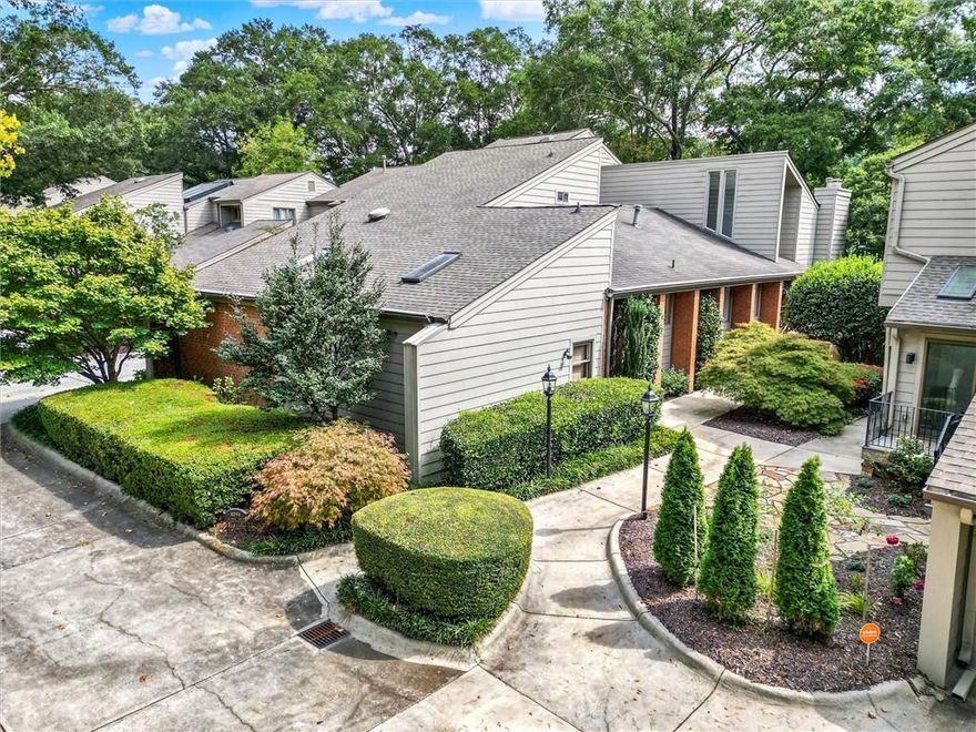 A million-dollar view for under a million! This one-of-a-kind Chattahoochee Riverfront home captures the perfect harmony of upscale design, prestige living, and effortless comfort without pretense. The wrap-around deck showcases some of the grandest river views you’ll find anywhere.
The magic unfolds from the grand foyer, with its soaring vaulted ceiling and truly spectacular 8’ tall double-door entry.
Walls of glass, soaring vaulted ceilings, and clerestory windows enhance the mid-century modern vibe as hardwood floors flow through the main level. This is one of only three homes in the community to feature a coveted main-level Master Suite.  With its secluded private entry, stunning river views, spa-like bath featuring twin vanities and oversize shower, it’s the perfect waterside retreat at the end of the day. Of course, Bedroom Suite number two is equally large and opulent, offering serene comfort for guests and extended family, alike.
River views fill your attention from the massive, vaulted Living Room anchored by a dramatic floor-to-ceiling fireplace surround. The elegant Study brings to mind the quiet comfort of a classic British gentlemen’s club. Nearby, a vaulted-ceiling Dining Room sets the stage for unforgettable dinner parties. For year-round indulgence, a glass-enclosed (even the ceiling is glass) multi-jetted hot tub creates a spa-like escape for relaxation or a therapeutic massage, regardless of the season. 
“Chef’s kitchen” perfectly describes the custom designed eat-in kitchen. Top-tier features include a tray ceiling, full-size paneled-front Sub-Zero refrigerator / freezer, Wolf cooktop with both a griddle and a grill, topped by a Wolf range hood. There’s also a Dacor wall oven / convection microwave combo, a 68” triple sink with commercial-grade faucet, triple-width window, luxurious cherry cabinetry including 2 appliance lifts, endless granite counter space, and a walk-in pantry. All the proper tools to excite the most discerning gourmand.
A few steps down from the kitchen, you’ll find a massive (the only one in the community) multi-purpose laundry room with a whole wall of storage cabinetry and plenty of room for a workout area, too. Still need more storage space? The garage adds another wall of storage cabinetry along with under-stair space, yet still affords room for your vehicles. There’s even a dedicated room for trash receptacles with convenient exterior and interior access!
But wait, there’s more! Upstairs, Bedroom number three doubles as a private office complete with built-in cabinetry, half bath, and storage for all that other stuff you have to put somewhere. It even has its own HVAC system for all-season comfort. To simplify your busy life, the HOA maintains the roof, (Hardee) siding, exterior landscaping, exterior pest control, trash pickup and water.
River Place is conveniently located near fine dining, easy highway access, and endless recreational opportunities that include tubing, kayaking, and fishing. Outdoor activities like hiking and biking are available on the area’s many trails, and you can also enjoy picnicking, wildlife viewing, and visiting parks like Don White Memorial Park and Morgan Falls Overlook Park. History buffs will love visiting the old paper mill ruins nearby.
Opportunities like this are rarely available—schedule your visit today and don’t miss your chance to enjoy upscale riverside living at its finest!