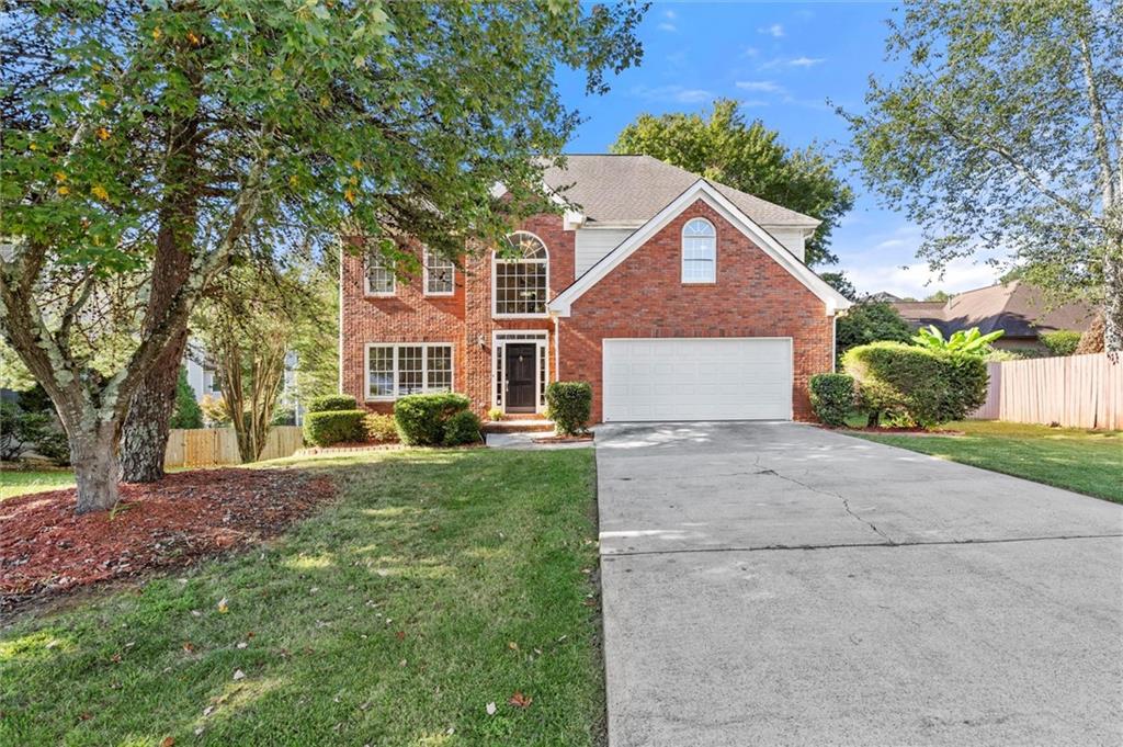 Welcome to this stunning 5-bedroom, 3.5-bathroom home nestled in The Gates subdivision of John's Creek. Beautiful hardwood floors flow throughout the main living areas, creating warmth and elegance from the moment you step inside.
The main level features a formal living room which can also serve as a flex space or office space, as well as a separate dining room ideal for hosting formal meals. The updated bathrooms showcase modern finishes and stylish design. Upstairs, you’ll find four spacious bedrooms and two full bathrooms, offering plenty of room for family and guests.
The full daylight walkout basement adds exceptional living space, including an additional bedroom and bathroom—perfect for a guest suite, media room, or recreation area. Step outside to enjoy a spacious, flat fenced backyard designed for play, pets, or entertaining, along with an outdoor deck that’s perfect for grilling or relaxing.
Residents of The Gates enjoy wonderful community amenities, including a pool and playground. Conveniently located near top-rated schools, shopping, dining, and all that John's Creek has to offer, this home is a must-see!