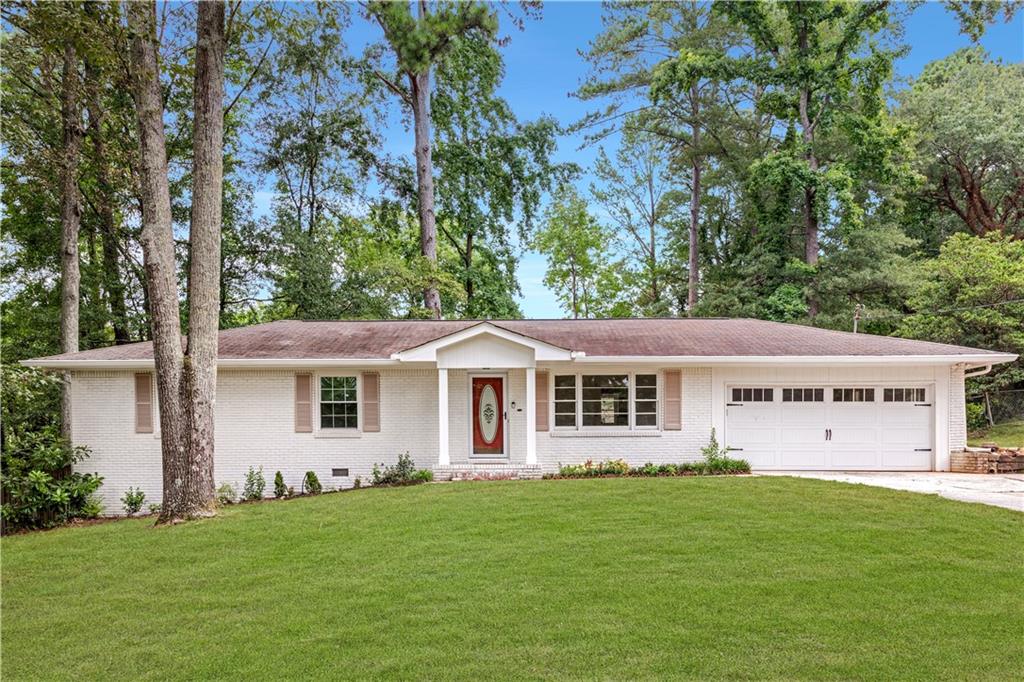 A Brick Ranch in a Quiet Setting in East Cobb!
This charming classic 4-sided brick ranch blends comfort and simplicity in a quiet, well-established neighborhood combined with the convenience of location. It offers a functional single-level layout with a semi-open floorplan, perfect for gathering and entertaining while maintaining defined spaces that give each area its own identity.
The exterior boasts timeless curb appeal with an expansive front yard, painted brick, neutral shutters, and clean lines that exude warmth. The inviting front porch and 2-car garage create a welcoming first impression. It’s simple yet elegant.
Inside, discover a spacious front living room, an additional back den area, a dining space, a functional kitchen with ample cabinet space, and three comfortable bedrooms with two full baths.
The fully fenced backyard adds to the appeal, offering a spacious patio for relaxation or grilling, ample room for play or gardening.
The appeal extends beyond the house to its location, just minutes from Truist Park, The Battery, amazing restaurants, premier shopping, and nearby Terrell Mill Park with turf fields and scenic walking trails. Enjoy easy access to everything Marietta and the Atlanta area have to offer. The highly acclaimed school district includes the newly renovated Eastvalley Elementary, East Cobb Middle, and Wheeler High School’s nationally ranked Magnet STEM Program.
This home is perfect for those seeking to set roots in East Cobb, in a well-established neighborhood, in a sought-after location.
