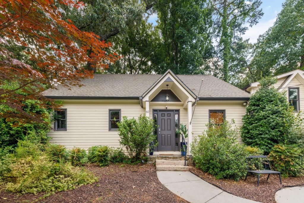 Nestled in the prestigious Buckhead area of Atlanta, this charming two-story single-family residence at 60 Honour Cir NW, Atlanta, GA 30305, blends traditional style with modern living. The home features elegant hardwood flooring throughout the main living areas and bedrooms, complemented by ceramic tile in the bathrooms. The heart of the home boasts an open-concept design, connecting a spacious living room with a fireplace to a dining area large enough for entertaining. The gourmet kitchen is equipped with stone counters, a large island with a breakfast bar, and stainless steel appliances, including a gas range and double oven, all offering a view to the family room. The house offers well-appointed bedrooms, including an oversized master suite with a sitting area, a double vanity, and a large walk-in shower in the master bath. Ceiling fans are present in the living areas and bedrooms, contributing to comfortable living. Outdoors, the property features a well-maintained, landscaped, and level backyard, complete with a fenced perimeter and a spacious deck, perfect for relaxation and outdoor gatherings. The paved driveway provides convenient parking for residents and guests.