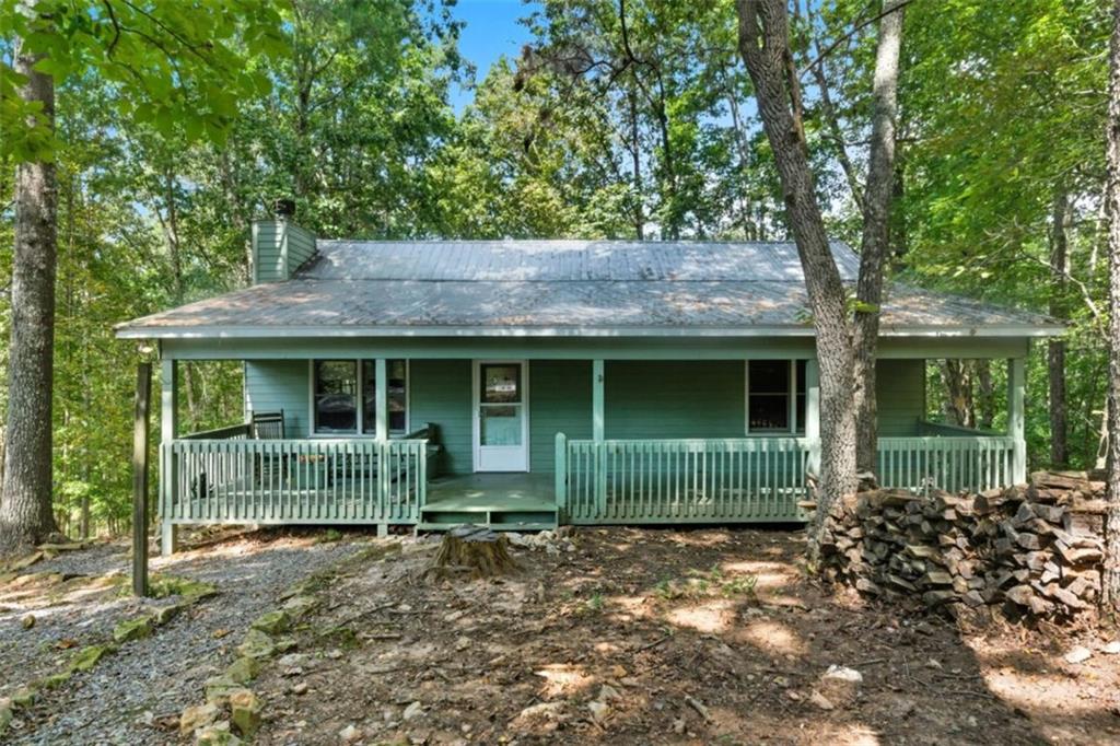 Welcome to 685 Riverview, where mountain living meets everyday comfort. This 3-bedroom, 3-bath home sits on a half-acre inside the desirable Coosawattee River Resort, giving you the best of both worlds-peaceful privacy with resort-style amenities at your fingertips. On the main level, you'll find two bedrooms including a bright primary suite with a newly remodeled bathroom, plus a cozy family room with a stone fireplace and an open kitchen that's ready for gatherings. The terrace level has been completely transformed into its own retreat, featuring a spacious living area, additional bedroom and bath, laundry, and plenty of room for a game room, gym, or movie nights. With two driveways and entrances, it's perfectly suited for guests or multigenerational living. Step outside and enjoy mornings with coffee on the porch, afternoons exploring the resort's river parks, and evenings by the fire after a swim or game of tennis. From fishing and kayaking to indoor pools and playgrounds, Coosawattee offers endless opportunities to live, play, and unwind. 685 Riverview isn't just a home-it's a mountain lifestyle, waiting for you.