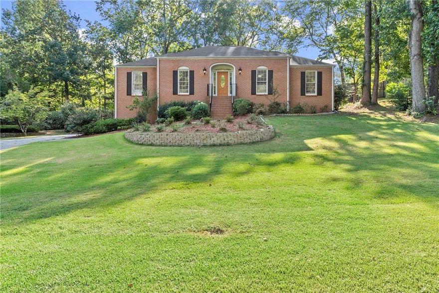 Welcome to your dream home featuring 3-sided brick ranch, perfectly situated in a serene, well-kept neighborhood with NO HOA! Located just minutes from Lassiter High School, this home has modern updates to offer a truly inviting living experience. The family room, with its dramatic vaulted ceiling, exposed wood beams, and cozy fireplace, seamlessly connects to the stylish kitchen and flows to the extra large sunroom. Enjoy the convenience of updated quartz countertops and NEW stainless-steel appliances in both the main and lower-level kitchens. The newly finished basement provides a versatile living space with a stepless entry, complete with a second kitchen, a bedroom, a full bath, and a dedicated home theatre. This area is perfect for extended family, guests, or as an entertainment hub. Recent updates include a new HVAC system, new countertops, 3 new toilets, and much more. The beautifully maintained front yard features recently removed trees and a replaced water line, enhancing the home's curb appeal. The enclosed sunroom adds a fantastic space for year-round entertaining, while the fenced backyard provides a great setting for outdoor activities. The oversized garage ensures plenty of storage space for all your needs.