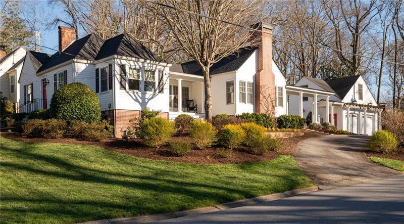 Featured in the book "Marietta - The Gem City of Georgia" as well as having been on the Tour of Homes, this well appointed GEM on Maple Ave is quite the catch! More recently this house has become known for its beautiful landscape that could easily win Yard of The Month every month! With the pristine landscape, beautiful addition and upgrades including the stately colonnade to the carriage house w/ 2 car garage, this home is quite the showstopper on one of Marietta’s most beloved streets. Inside is just as spectacular with historical details paired perfectly with updated open living. This 3 bedroom 3 bath home (2 bed/2 bath in the almost 2K sq ft main house with another 600 sq ft 3rd bed and bath, in the carriage house) has been meticulously maintained! From the circular drive you will find the back porch entrance overlooking a stunning terrace with a beautiful brick fireplace. Step inside this amazing home and see the spacious family room with vaulted ceilings with wainscoting & the 2nd of 3 fireplaces. 2 lovely built-in bench seats flank the fireplace giving you a perfect spot to curl up with a good book. The family room is open to the kitchen separated slightly by 2 more beautiful columns and clever architectural details that make this home such a unique and stylish space. The custom built island is the heart of this kitchen w/ glass front cabinets, fabulous molding & lighting inside
as well as under the cabinets. Dining room has built-in bench seating & recessed cabinetry that is a beautiful reminder of the great history of the home and the details of that era. There is also a side porch, the perfect spot to sit and enjoy sunset. Wandering on to the front of the home you will find the formal living room w/ 3rd fireplace & gas logs as well as a built-in bookcase leading to cheery office w/ so many windows, built-in desk & beautiful wood paneling. The primary suite is on the back of the home giving you great privacy, w/ french doors that lead out onto the back porch overlooking the terrace. Private bathroom w/ custom cabinets that will give you a place for everything along w/ a walk in closet. 2nd bedroom on the front of the home adjacent to hall bath which features walk-in shower all updated in classic tiles that will never go out of style! A back hall connects both bedrooms to the laundry room and additional closet space as well as a built-in pantry. Beautifully restored hardwood floors & plantation shutters throughout the main house show how no detail has been overlooked. Just steps from the back porch is the most amazing terrace w/ fireplace and even a second patio area with a large brick outdoor kitchen complete with a gas grill and sink. The mixture of bricks and natural stones give such a warmth and nod to timely elegance rarely found these days. You can access the carriage house from the back terrace or with just a few steps through the colonnade that takes you into the garage and to the staircase leading you to the 3rd bedroom and private bath with great storage. This could be a perfect STR. Garage has room for 2 cars as well as work space. This house is a must see and you will not believe the yard come spring when everything start to bloom. Lots of great flowering bushes make it easy to maintain. So much love and care has been put into this yard, including a sprinkler system. The main house also features a fire sprinkler system, brand new roof, and exterior paint. HVAC and water heaters have been replaced in the last few years so nothing to worry about in this lovely home. Now let’s talk about the location!! Maple Ave is sought after for many reasons, top schools being one, but the holiday orbs turn this street into a winter wonderland. The Halloween parade is a must see! A short stroll to the Marietta Square w/ the fun concerts, festivals, amazing restaurants and shopping. The MTR trail & the Kennesaw Mt Nat'l Park all right in the area. It really doesn’t get any better than 255 Maple Ave!