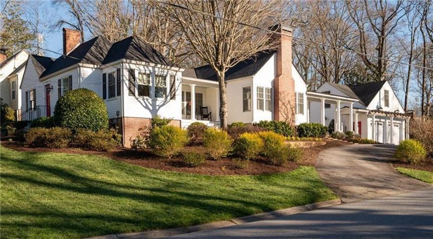 Featured in the book "Marietta - The Gem City of Georgia" as well as having been on the Tour of Homes, this well appointed GEM on Maple Ave is quite the catch!  More recently this house has become known for its beautiful landscape that could easily win Yard of The Month every month! With the pristine landscape, beautiful addition and upgrades including the stately colonnade to the carriage house w/ 2 car garage, this home is quite the showstopper on one of Marietta’s most beloved streets. Inside is just as spectacular with historical details paired perfectly with updated open living. This 3 bedroom 3 bath home (2 bed/2 bath in the almost 2K sq ft main house with another 600 sq ft 3rd bed and bath, in the carriage house) has been meticulously maintained! From the circular drive you will find the back porch entrance overlooking a stunning terrace with a beautiful brick fireplace. Step inside this amazing home and see the spacious family room with vaulted ceilings with wainscoting & the 2nd of 3 fireplaces. 2 lovely built-in bench seats flank the fireplace giving you a perfect spot to curl up with a good book. The family room is open to the kitchen separated slightly by 2 more beautiful columns and clever architectural details that make this home such a unique and stylish space. The custom built island is the heart of this kitchen w/ glass front cabinets, fabulous molding & lighting inside 
as well as under the cabinets. Dining room has built-in bench seating & recessed cabinetry that is a beautiful reminder of the great history of the home and the details of that era.  There is also a side porch, the perfect spot to sit and enjoy sunset. Wandering on to the front of the home you will find the formal living room w/ 3rd fireplace & gas logs as well as a built-in bookcase leading to cheery office w/ so many windows, built-in desk & beautiful wood paneling.  The primary suite is on the back of the home giving you great privacy, w/ french doors that lead out onto the back porch overlooking the terrace. Private bathroom w/ custom cabinets that will give you a place for everything along w/ a walk in closet. 2nd bedroom on the front of the home adjacent to hall bath which features walk-in shower all updated in classic tiles that will never go out of style! A back hall connects both bedrooms to the laundry room and additional closet space as well as a built-in pantry.  Beautifully restored hardwood floors & plantation shutters throughout the main house show how no detail has been overlooked. Just steps from the back porch is the most amazing terrace w/ fireplace and even a second patio area with a large brick outdoor kitchen complete with a gas grill and sink.  The mixture of bricks and natural stones give such a warmth and nod to timely elegance rarely found these days.  You can access the carriage house from the back terrace or with just a few steps through the colonnade that takes you into the garage and to the staircase leading you to the 3rd bedroom and private bath with great storage. This could be a perfect STR. Garage has room for 2 cars as well as work space. This house is a must see and you will not believe the yard come spring when everything start to bloom. Lots of great flowering bushes make it easy to maintain. So much love and care has been put into this yard, including a sprinkler system. The main house also features a fire sprinkler system, brand new roof, and exterior paint.  HVAC and water heaters have been replaced in the last few years so nothing to worry about in this lovely home.  Now let’s talk about the location!!  Maple Ave is sought after for many reasons, top schools being one, but the holiday orbs turn this street into a winter wonderland.  The Halloween parade is a must see! A short stroll to the Marietta Square w/ the fun concerts, festivals, amazing restaurants and shopping.  The MTR trail & the Kennesaw Mt Nat'l Park all right in the area. It really doesn’t get any better than 255 Maple Ave!