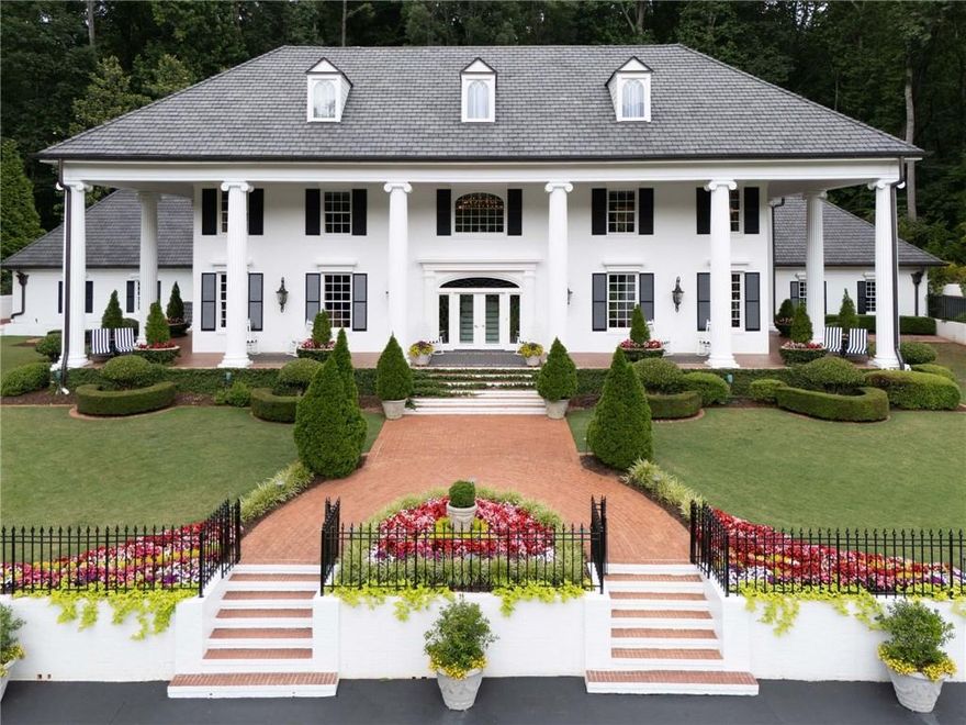 Private gated Estate home on 3.3 acres. Total renovation. 10 ft. ceilings on the main and upper levels. Enormous Master suite with stunning bathroom. Split staircase with marble foyer. New "Viking" kitchen will accommodate the most sophisticated chef. 3 car garage with additional parking for 50 cars on circular gated driveway. Nothing compares to this Southern Antebellum Home with 10 huge Ionic columns on the wrap around porch. An indoor pool in the west wing. Quality construction rarely found. Full finished terrace level with theater, bar, gym.