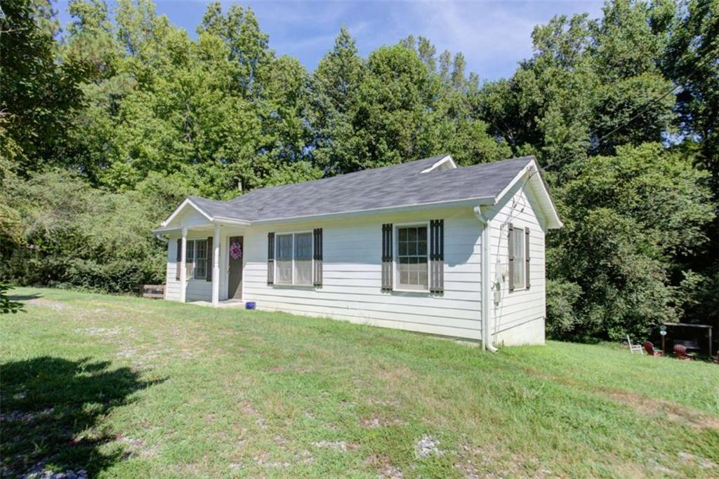 Welcome to 7335 Westray Rd - an adorable, move-in ready ranch home located in the heart of Cumming and zoned for the highly sought-after Forsyth County schools. Listed at just $275,000, this charming 2-bedroom, 2-bath home with a versatile bonus room offers the perfect combination of style, function, and affordability. Fully renovated in 2023, the home features an open-concept living and kitchen area that is both spacious and inviting-ideal for entertaining or enjoying cozy evenings at home. The kitchen flows seamlessly into the living space, creating a warm and welcoming atmosphere. The additional bonus room offers endless possibilities-use it as a home office, playroom, guest space, or creative studio. Both bedrooms are generously sized. Step outside to enjoy your private yard. The fenced side yard is perfect for pets or gardening, and the large open backyard offers plenty of room for play, entertaining, or relaxing by the fire pit. An outbuilding provides extra storage or space for hobbies and tools. Whether you're a first-time homebuyer, retiree, or investor, this property has something for everyone. Nestled in a quiet area but still close to local shopping and dining, this home provides the perfect balance of convenience and comfort. Don't miss this incredible opportunity!