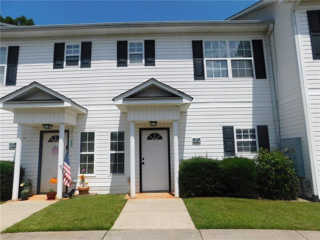 Discover an amazing townhome in the heart of Dahlonega, just two miles from the University of North Georgia and the bustling Dahlonega Town Square. This thoughtfully designed townhome features two spacious master suites, each with a full bath and walk-in closets, providing ample storage and comfort. An additional half bath is conveniently located on the main floor for guests. The generous layout includes a large kitchen equipped with modern appliances, a welcoming family room, and a separate dining room perfect for entertaining. Enjoy the convenience of washer and dryer hookups, as well as a refrigerator, dishwasher, and central heating and air conditioning. A monthly fee of $65 covers water, garbage, and lawn maintenance, ensuring hassle-free living. No pets allowed. **Please note that pictures are not of actual unit, but are an accurate representation.