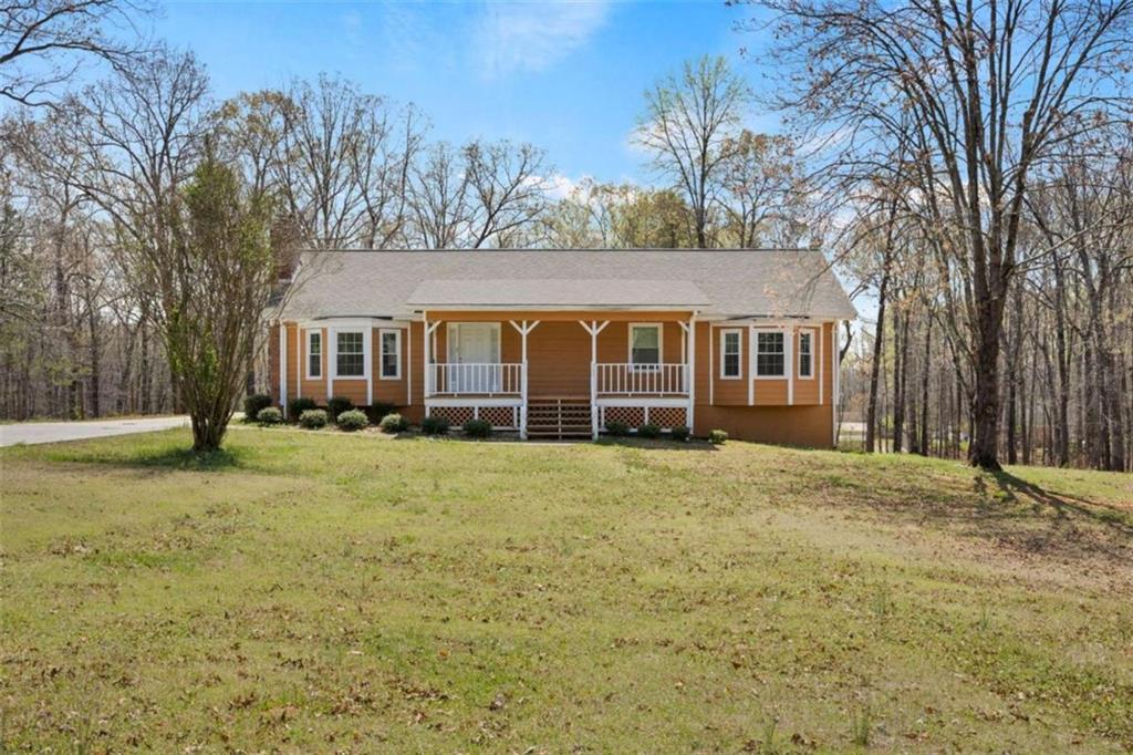 Welcome to your next mini homestead! Home rest on 2 acres in quiet Fayette County. Not far from food and shopping and more yet set off in a quiet neighborhood that allows the kiddies to play in peace. Home has been fully remodeled with all new roof, flooring, ac unit, hot water tank, all new kitchen appliance's and bathrooms just waiting for you.