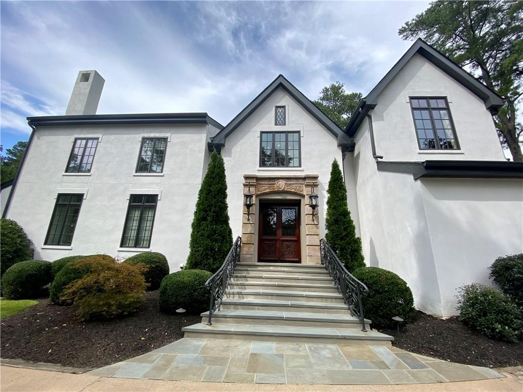 Rare opportunity in one of Atlanta's most desirable estate neighborhoods in zip 30327. Situated on 1.5 acres, with a new/private tennis, pool, spa outdoor fireplace and grill. Private, gated and nestled in the trees. Perfect for entertaining with patios that wrap around an outdoor kitchen, fireplace, tennis courts, basketball and gorgeous redone pool and spa. Design sensitive redesign of interiors/exterior throughout. Hard coat stucco. Transitional, open with soaring ceilings and walls of glass with views of the pool. Living room and study upstairs overlook the pool. Honed marble in the kitchen and breakfast room filled with natural light and overlooking the pool and tennis court. Plenty of property behind the pool as well! Keeping room with fireplace is open to the kitchen creating an informal living, dining and entertaining environment. Large dining room that is open to the 2 story living room with a wall of glass, overlooks the pool and and grounds. Upstairs is a private owners suite with custom closet systems and spa bath. Hardwood floors throughout and freshly painted interiors with a perfect neutral palette ready for the next owners! Very large room and bath on third floor for cozy evenings and a movie, studio or kids playroom. Gym, additional bedroom and entertaining area downstairs at the pool. Terrific location in highly desirable area that is close to Chastain Park and near the best private schools and shopping in Atlanta.