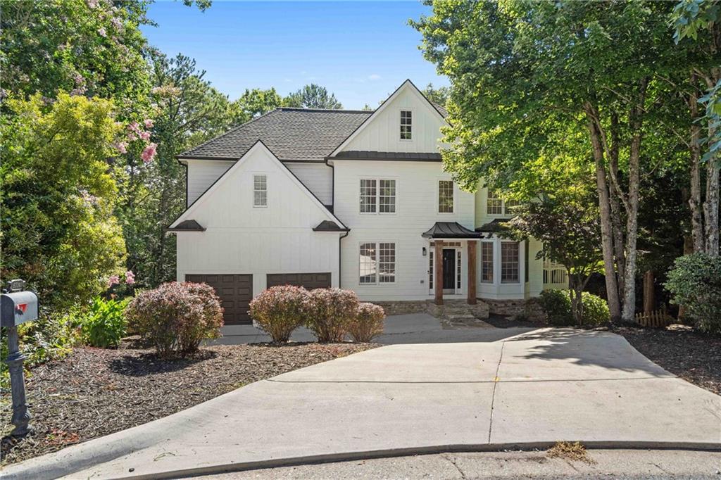 Welcome to your dream home in the highly sought-after Forsyth County! This immaculate five-bedroom, four-bath residence has been fully renovated to perfection, offering you a luxurious and comfortable living experience like no other. As you step inside, you will be immediately captivated by the elegant and modern design that flows throughout the entire home. The open concept floor plan seamlessly connects the spacious family room which is bathed in natural light, thanks to the picture windows that offer breathtaking views of the surrounding area, dining area, and gourmet kitchen, making it perfect for entertaining family and friends. The beautifully renovated kitchen is a chef's delight, featuring stainless steel appliances, sleek countertops, ample storage space, and a large breakfast bar for all to gather. Adjacent to the kitchen, you will find a cozy breakfast nook, perfect for enjoying your morning coffee while overlooking the serene backyard. The second floor boasts a luxurious master suite, complete with a walk-in closet and a spa-like ensuite bathroom. Four additional well-appointed bedrooms provide plenty of space for a growing family or guests, and the three additional bathrooms have been tastefully updated with modern fixtures and finishes. This home offers a perfect blend of indoor and outdoor living, with a spacious backyard that is ideal for hosting summer barbecues or simply relaxing in the sun. Two decks offer ample space for outdoor entertaining, while the private backyard provides a serene escape from the hustle and bustle of everyday life. Conveniently located in Forsyth County, you will enjoy easy access to top-rated schools, shopping centers, dining options, and recreational facilities. This vibrant community offers a plethora of amenities, including parks, golf courses, and a variety of outdoor activities to suit every interest. This house is truly a gem, ready for its new owners to move in and create lasting memories. Don't miss the opportunity to make this stunning, fully renovated home yours. Schedule your showing today and be prepared to fall in love with this exceptional property!