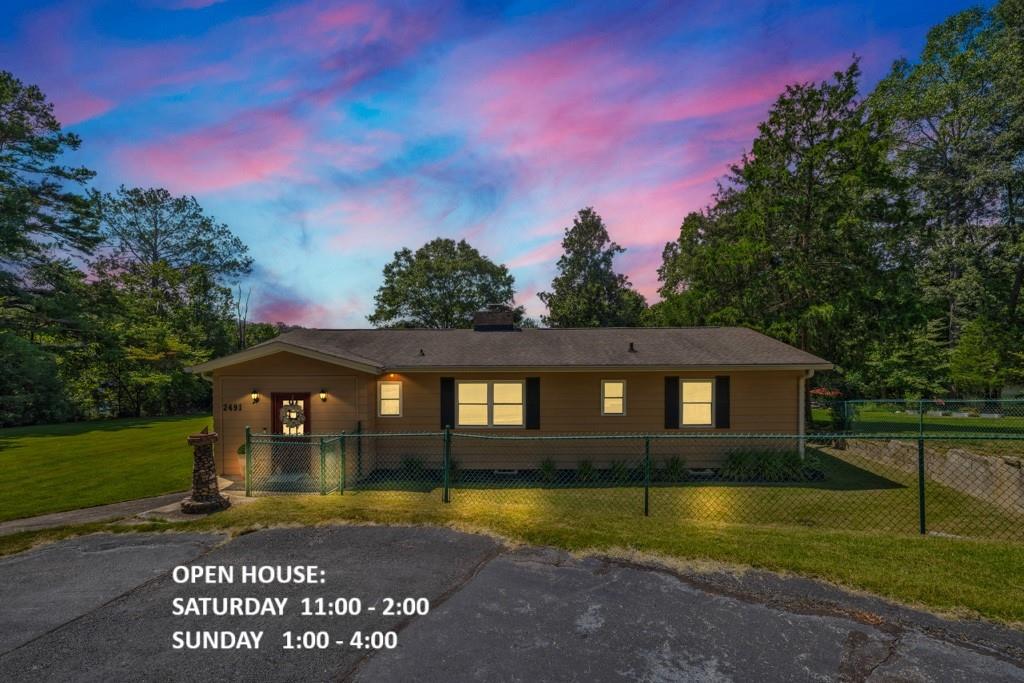 Lake, Lake, Lake! Enjoy lakefront living with 151 feet of shoreline on the stunning 55 +|- acre Rockdale Lake! This lot has one of the largest shorelines on the lake! This one level 2-bedroom, 1.5-bath home also features a versatile bonus room which can also serve as a 3rd bedroom, office, or game room. Inside, you'll appreciate a generous laundry and pantry offering plenty of storage and functionality. The exterior is just as impressive with stunning lake views, a fenced side yard perfect for pets, circular driveway, two-car carport with attached storage, plus a separate storage-workshop. Relax and entertain at the large lakefront fire pit, or enjoy endless water activities-boating, fishing, jet skiing, paddle boarding, kayaking, swimming, and more. This meticulously maintained 0.59-acre lot with lush Zoysia grass awaits your outdoor games and family gatherings. Spend evenings enjoying lake cruises and have the convenience of your own private dock. Water depth at dock is 8' +. Conveniently located close to downtown Conyers, shopping, restaurants, and with easy access to Interstate 20. Don't let this gem pass you by!