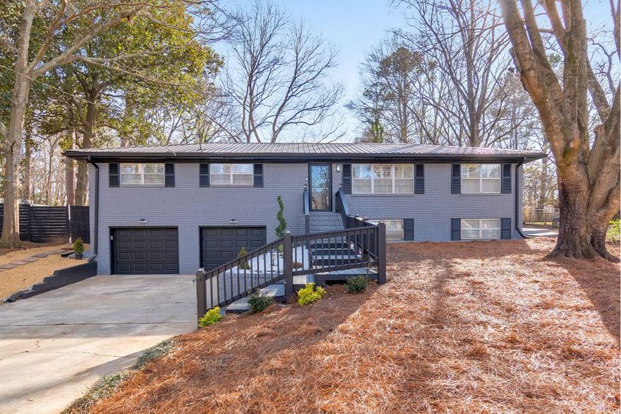 Discover this beautifully updated 4 bed / 3 bath home where modern luxury meets timeless design. From the moment you arrive, you’ll notice the meticulous attention to detail and high-end finishes throughout. Recent upgrades include a 2024 HVAC system, a new water heater, an updated electrical panel, new interior plumbing, and waterproof LVP flooring. Plantation shutters, crown molding, and refinished/new hardwoods enhance the home’s charm, while abundant natural light creates an inviting atmosphere. The thoughtfully designed main level features a welcoming dining room at the entrance that flows seamlessly into the open-concept living room and kitchen. The chef's kitchen is a showstopper, showcasing stainless steel appliances, granite countertops with a waterfall edge, a breakfast bar, and elegant white cabinetry. Adjacent to the kitchen, the renovated mudroom offers a convenient laundry area, cabinets, and a counter area. The primary suite features his and hers closets and a beautifully updated ensuite bathroom. Two additional main-level bedrooms share a thoughtfully renovated bathroom with modern finishes. Downstairs, the finished basement features beamed ceilings, a spacious living area perfect for entertaining, a bedroom, and a full bathroom. Step outside to your private outdoor retreat in the expansive fenced backyard. A brand-new deck, complete with a grill, fire pit area, and hot tub, creates the ideal setting for relaxation. The newly added gazebo, featuring an island, offers a wonderful space for hosting gatherings, while outdoor bistro lighting adds a warm, inviting ambiance. Additional upgrades include a metal roof, concrete perimeter around the home, upgraded drainage, and a freshly painted garage. Don’t miss your opportunity to make this delightful home yours!