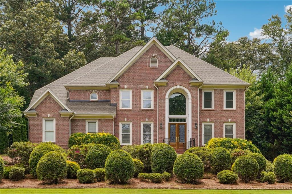 Exquisite Executive Residence in the Coveted Parkview High School District
Welcome to this stately brick estate, thoughtfully designed with luxury, space, and sophistication in mind. Upon entry, you are greeted by a dramatic two-story foyer adorned with a tiled entryway and gleaming hardwood floors that extend throughout the main level. The home features a formal dining room with extensive trim detail, designer lighting, and an elegant ambiance ideal for entertaining. Opposite the dining room is a separate formal living room or home office, perfectly suited for today’s versatile lifestyle.
The grand two-story family room boasts architectural archways with mirrored accents, custom built-in cabinetry, and a stunning marble fireplace, all framed by executive-style trim and coffered ceilings. The expansive eat-in kitchen features a charming bay window bump-out, flooding the space with natural light. A true chef’s kitchen, it includes a counter-depth refrigerator, abundant custom cabinetry, premium countertops, high-end appliances, sophisticated lighting, and a generously sized walk-in pantry.
The oversized primary suite offers a tranquil retreat with a private sitting area, double recessed tray ceiling with crown molding, and abundant windows. The luxurious en-suite bath includes a large garden tub, dual vanities, a spacious tiled shower with built-in bench, and an expansive walk-in closet.
Secondary bedrooms are generously proportioned, including one with a private full bath and walk-in closet, and two additional bedrooms connected by a Jack-and-Jill bath with separate vanities—each with excellent natural light and ample storage. A large linen closet and a sprawling laundry room with built-in shelving provide functionality and organization.
The open staircase leads to a fully finished terrace level, which includes a sprawling entertainment room with custom cabinetry, a media room, a guest suite with a walk-in closet and private full bath, and a convenient half bath. Additional unfinished areas offer workshop space, built-in shelving, and house recently updated mechanical systems—including a water filtration system—ideal for hobbyists or extra storage.
This exceptional residence offers refined living with timeless design and is truly a must-see for the discerning buyer.