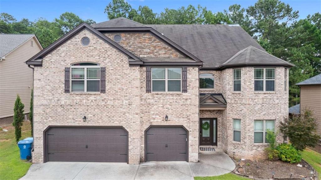 Welcome to the largest floor plan in the Austin Commons subdivision. This house is the perfect example of having both quiet and accessibility. Walking in you will be greeted with an open style living room with vaulted ceilings and cozy fireplace, kitchen with ample cabinet space, along with the formal adjoining dining room. There are no shortage of bedrooms here, with all 6 having their own walk-in closets. This amazing home has the luxury of being minutes away from shopping and Publix, while also being approximately 20 minutes from Snellville and Lawrenceville. Further noting its an easy 1 hour drive to the ATL airport. Don't miss this opportunity to experience where luxury, tranquility, and accessibility come together to make the best home for you!