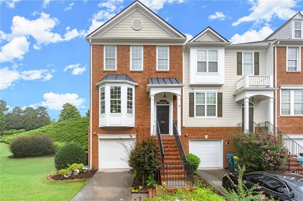 Light-filled, beautifully updated, and packed with charm - this stunning 3-bedroom, 2.5-bath townhome in the coveted Woodlands community blends timeless style with modern comfort. Meticulously maintained, it features a brand-new roof (less than 1 year old), a newer expansive deck, fresh exterior paint, rich crown molding, elegant iron balusters, and stylish newer LVP flooring. The sun-drenched open floor plan showcases generous ceiling heights, abundant natural light, and a cozy gas fireplace, while the spacious bedrooms and versatile lower-level bonus room offer comfort and flexibility. Outside, a private fenced backyard with a quiet, calm patio or the main level deck are the perfect spots for morning coffee, evening unwinding, or hosting friends. Enjoy resort-style amenities including two sparkling pools (one with a thrilling waterslide), 10 tennis courts, pickleball courts, basketball, sand volleyball, scenic nature trails, an expansive playground, and a welcoming clubhouse. Located in Woodstock’s top-rated school district and just minutes from vibrant Downtown Woodstock’s shops, dining, cultural events, and lush parks, this home offers the perfect balance of luxury, convenience, and community. Don't miss out on this one and come see it today!